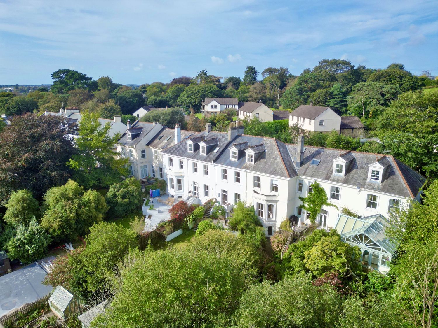 An outdoor view of a house with a garden at Trenare in Truro