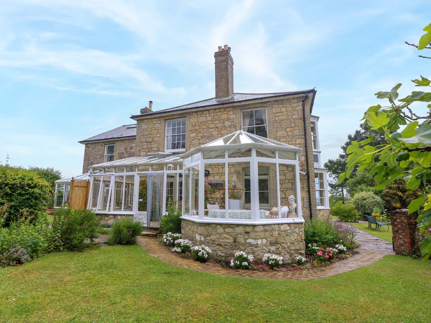 A house with garden and conservatory at Woodlands in Freshwater