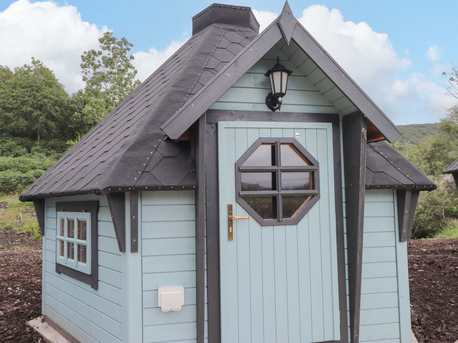 A house with a door and windows at Little Luxe Lodges 2 Balmacara near Kyle of Lochalsh