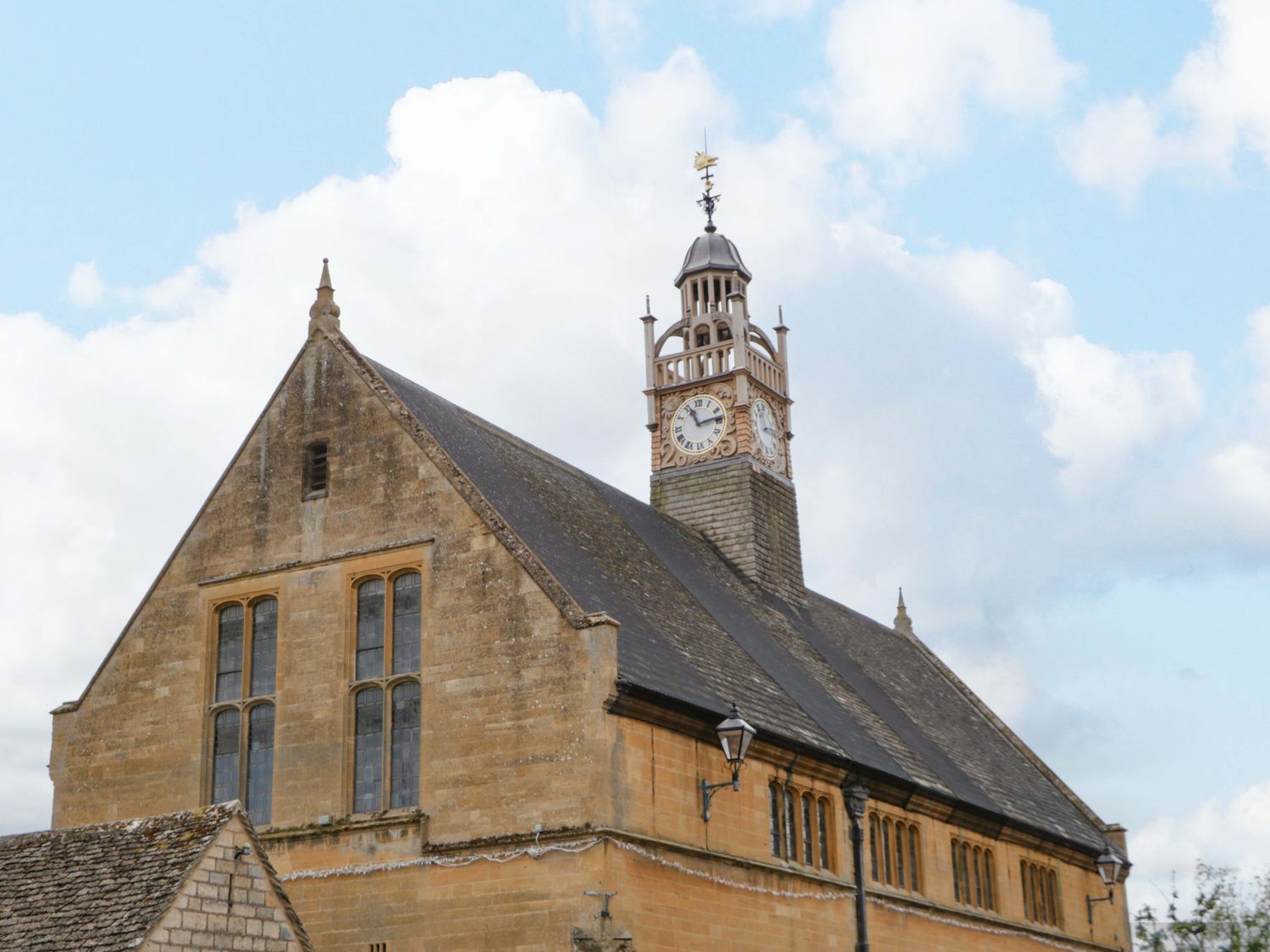 A building with a clock tower at Elm Cottage Moreton-In-Marsh