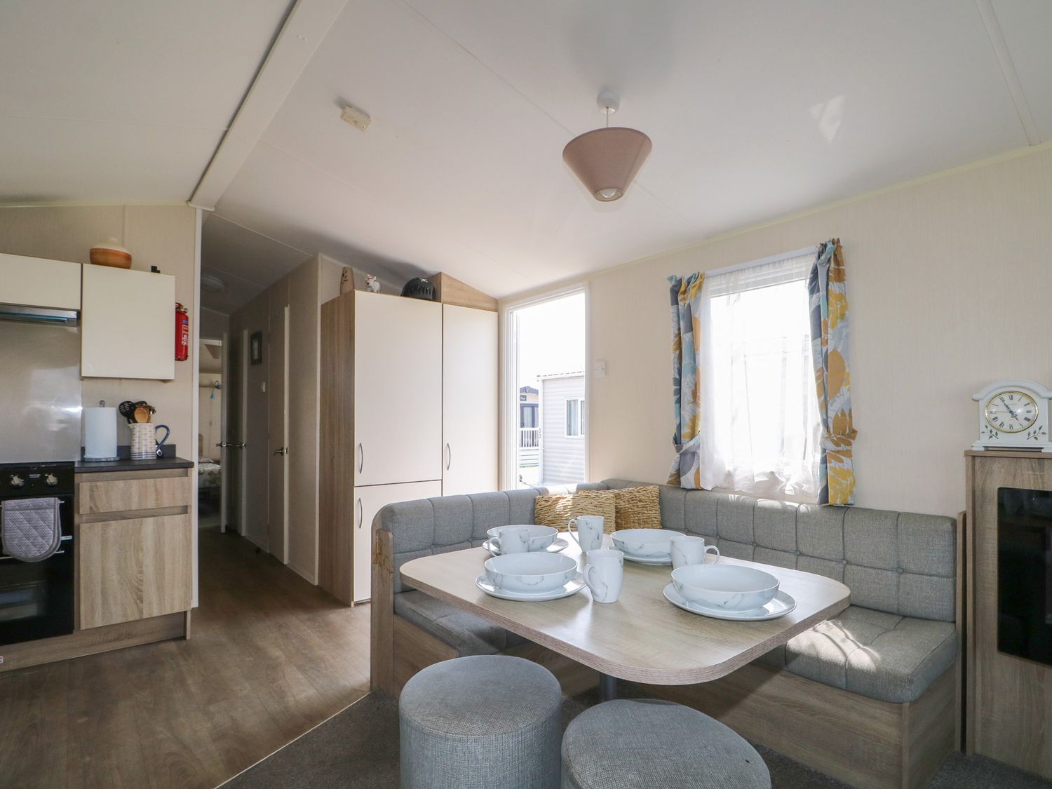 A kitchen with a dining area and cabinets at Tower View Number 34 Pevensey