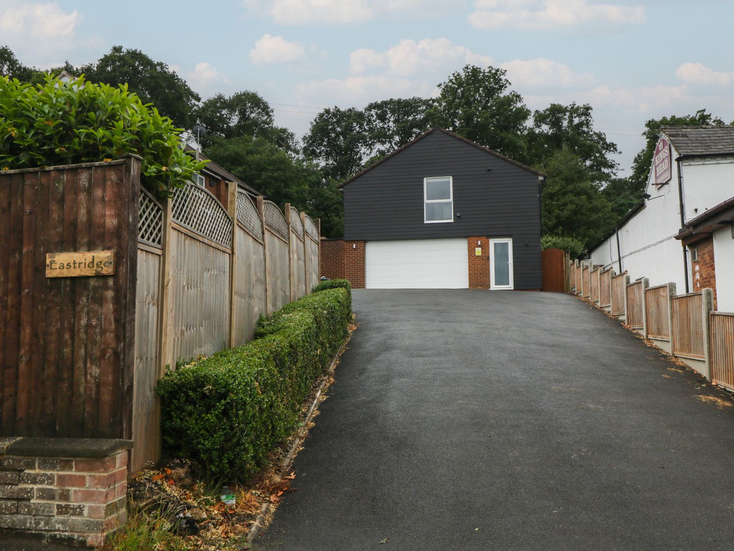A house with a garage and fence at The Annex in 