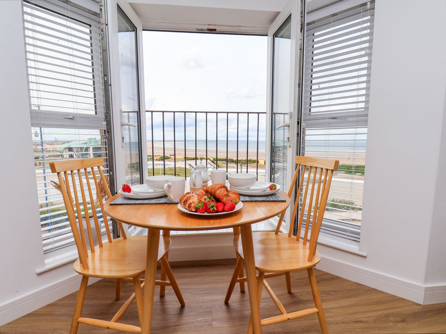 A dining area with a table set for breakfast at Apartment 6 (1 bed) Redcar