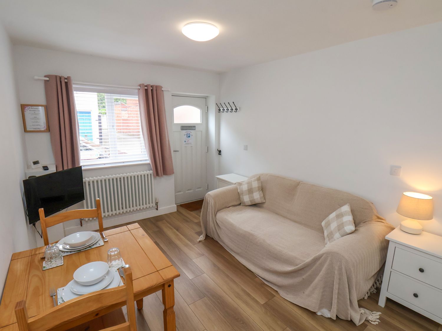 A living room with a table and chairs at 94 Church Street in Guisborough