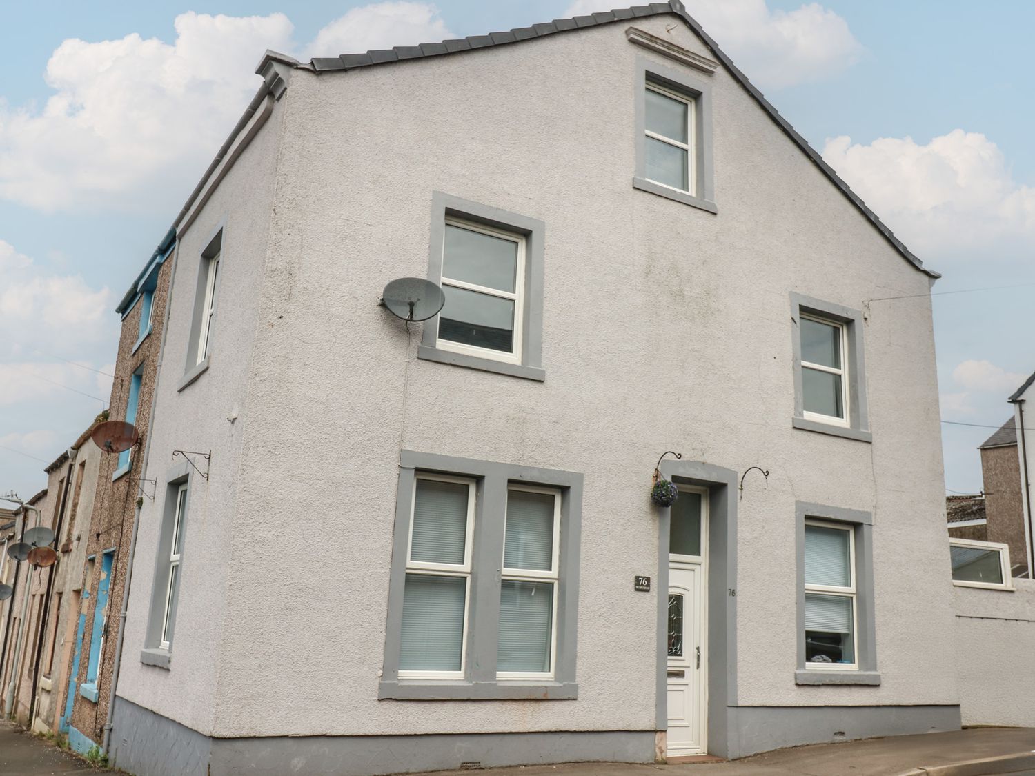 A house with multiple windows and a front door at Ennerdale Edge in Cleator