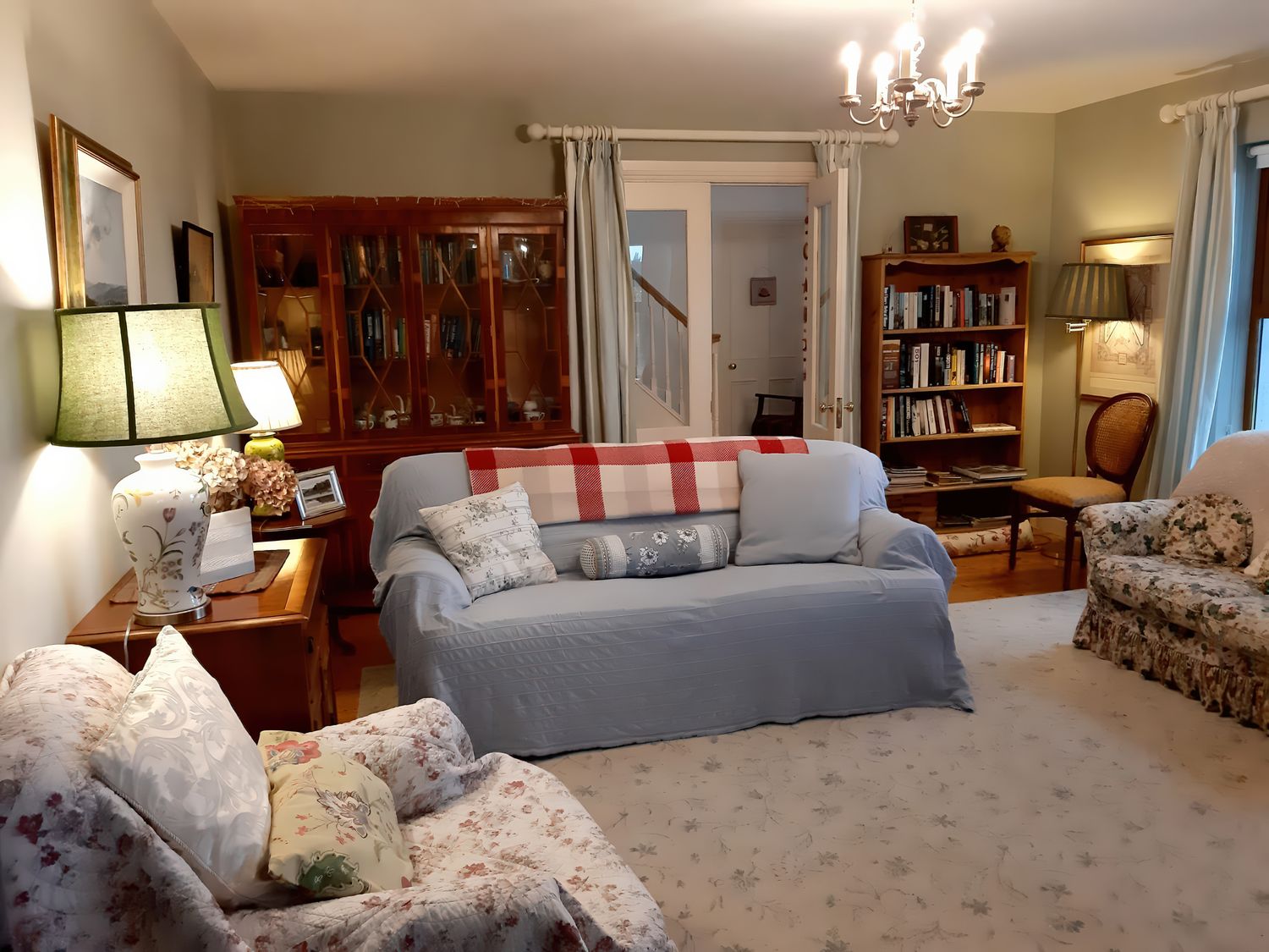 A living room with a sofa and bookshelves at Moynish Mor Mulranny MULRANNY