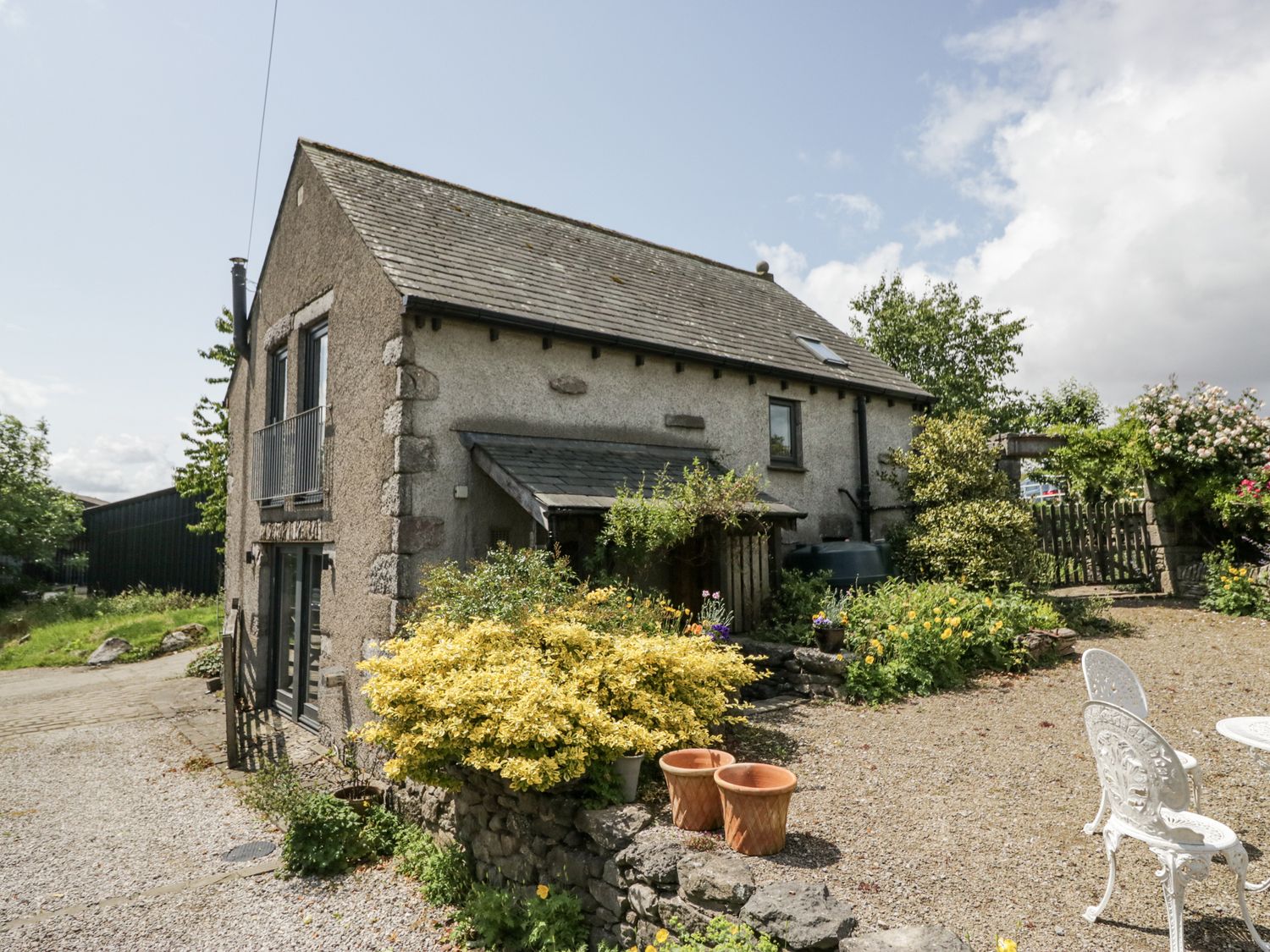 A house with a garden and patio at Treacle in Carnforth