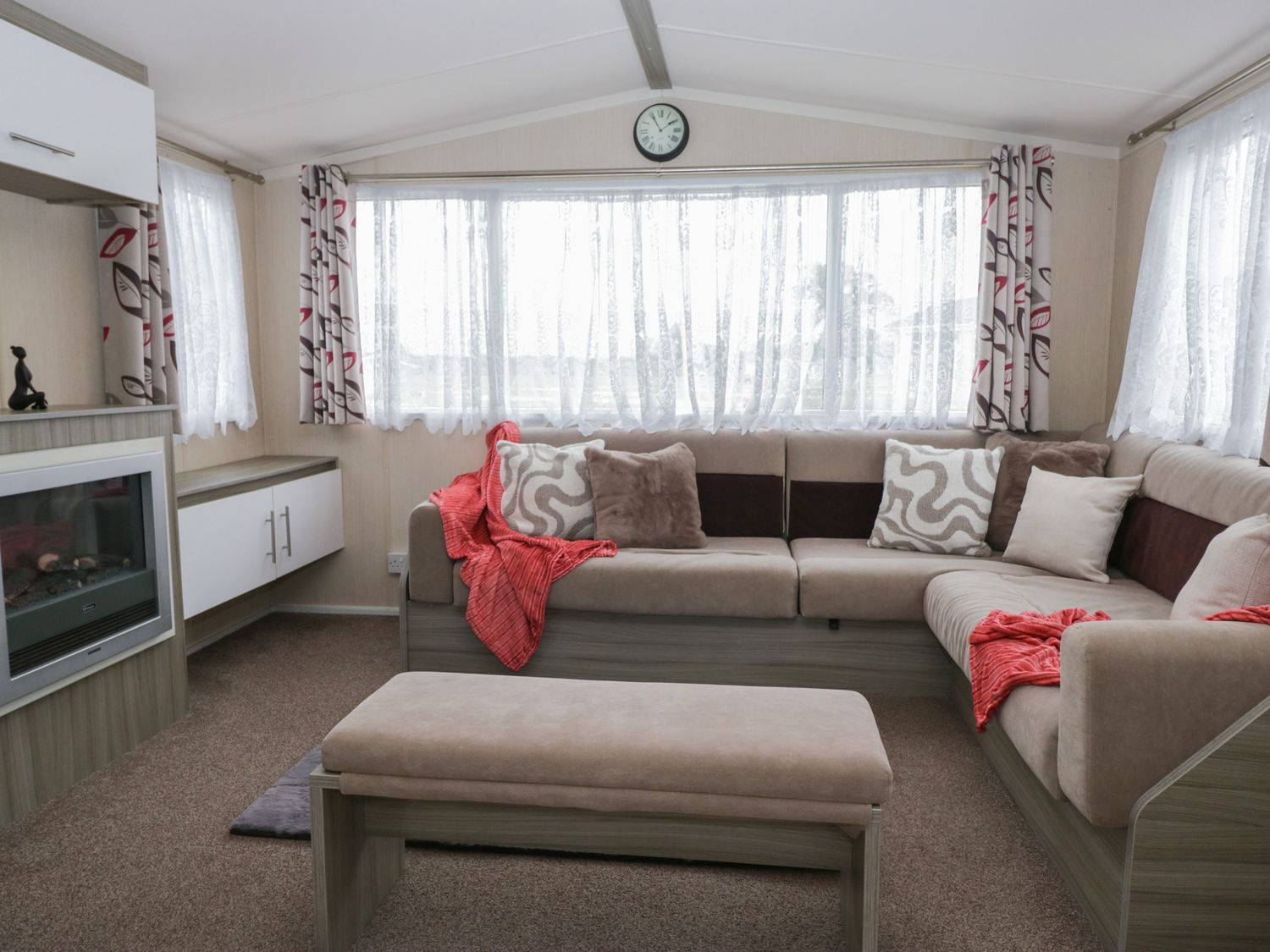 A living room with a sofa and coffee table at Heathfield Park S4
