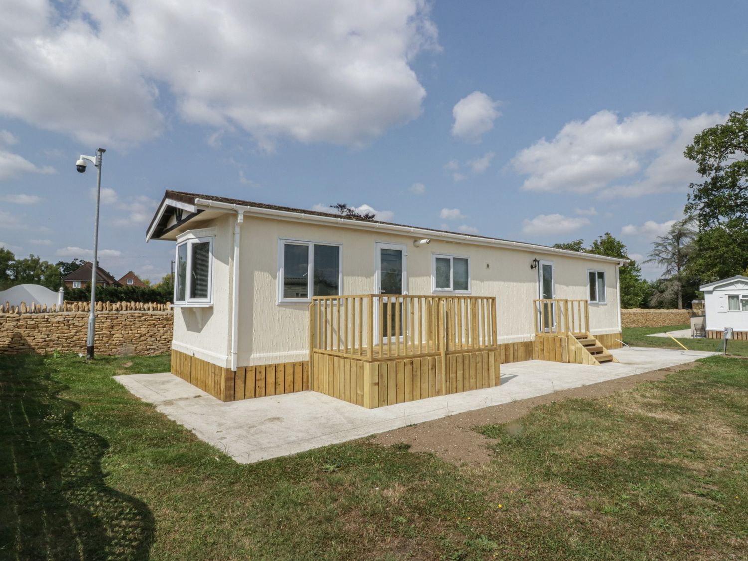A house with a deck and steps at Cherry Tree, Kidlington