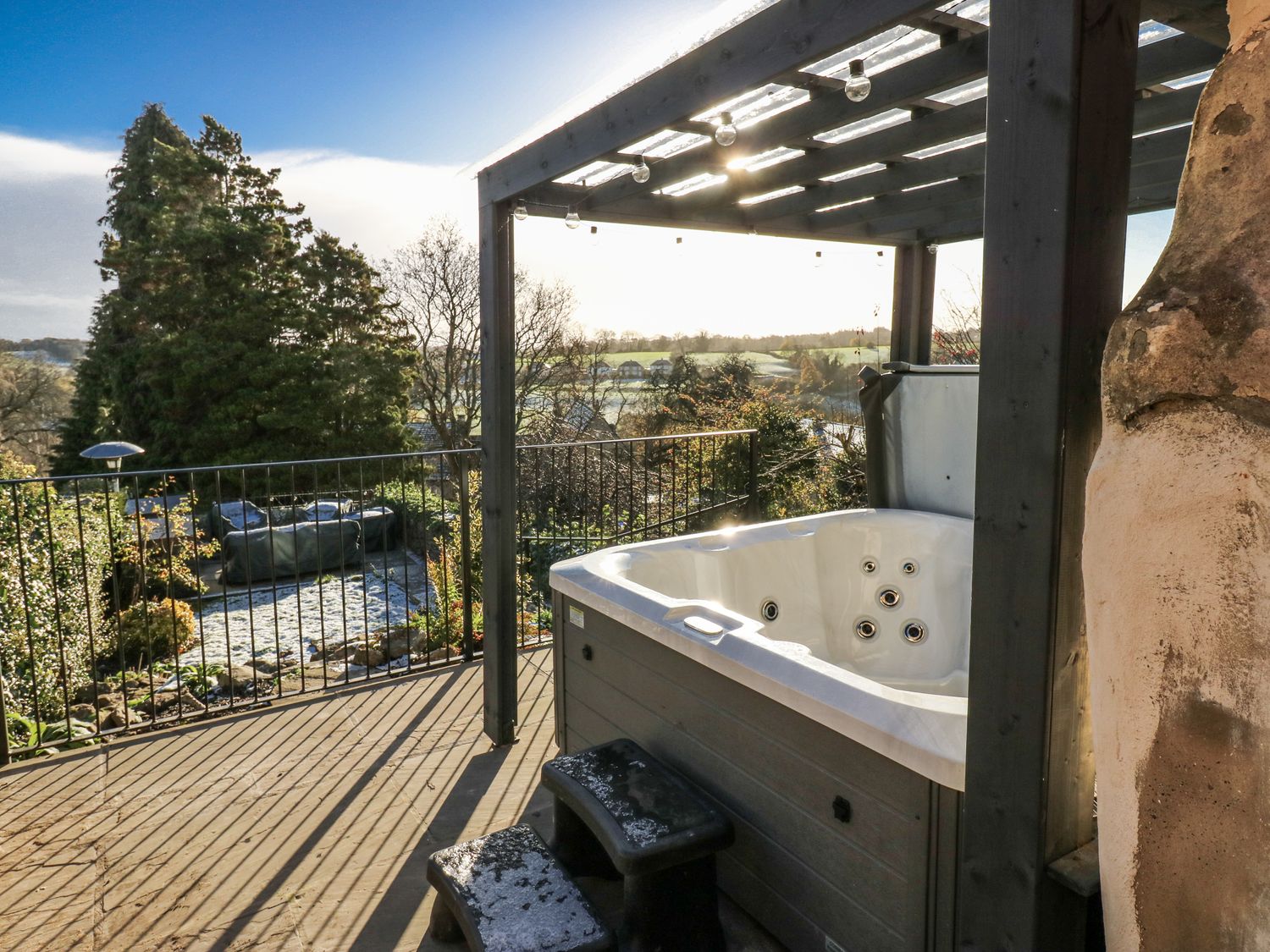 A hot tub on a deck with views in an outdoor space at 26 Frenchgate Richmond