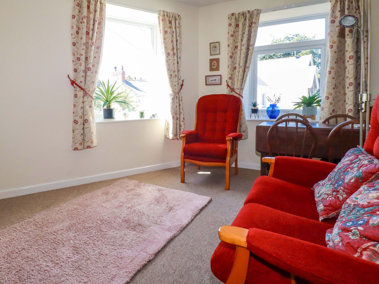 A living room with chairs and a table at Chyancrowse in Gulval