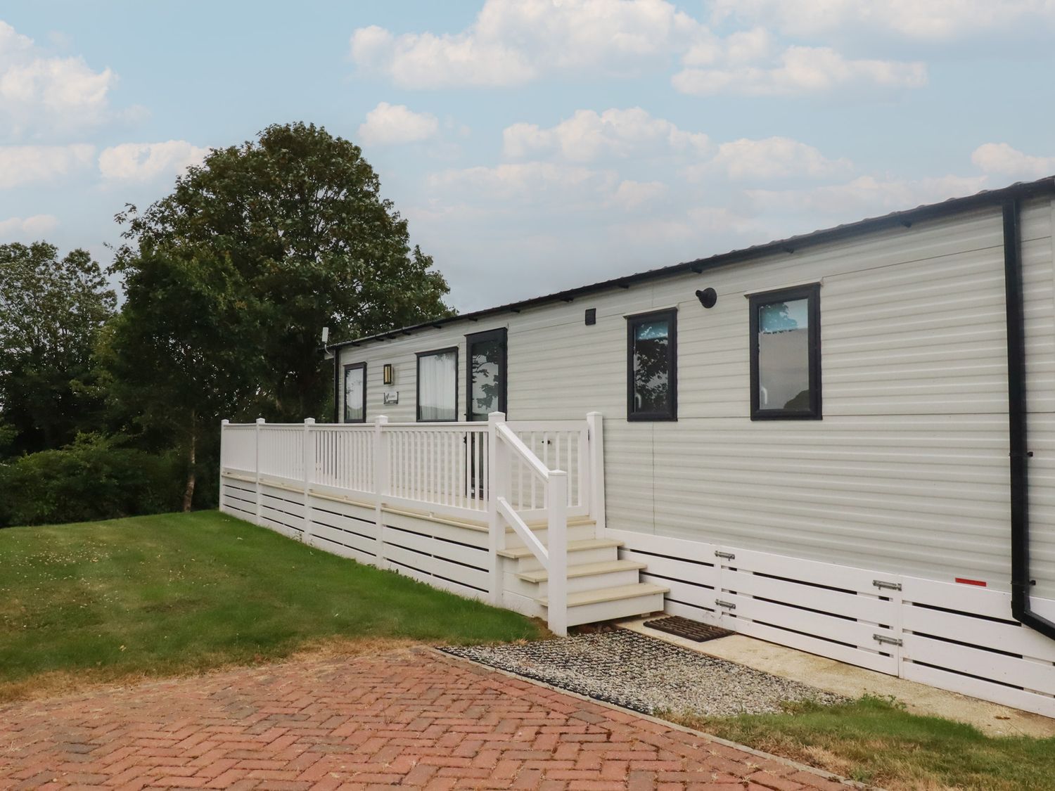A mobile home with steps and deck area at The Maples, no. 56 Hewas Water near Polgooth
