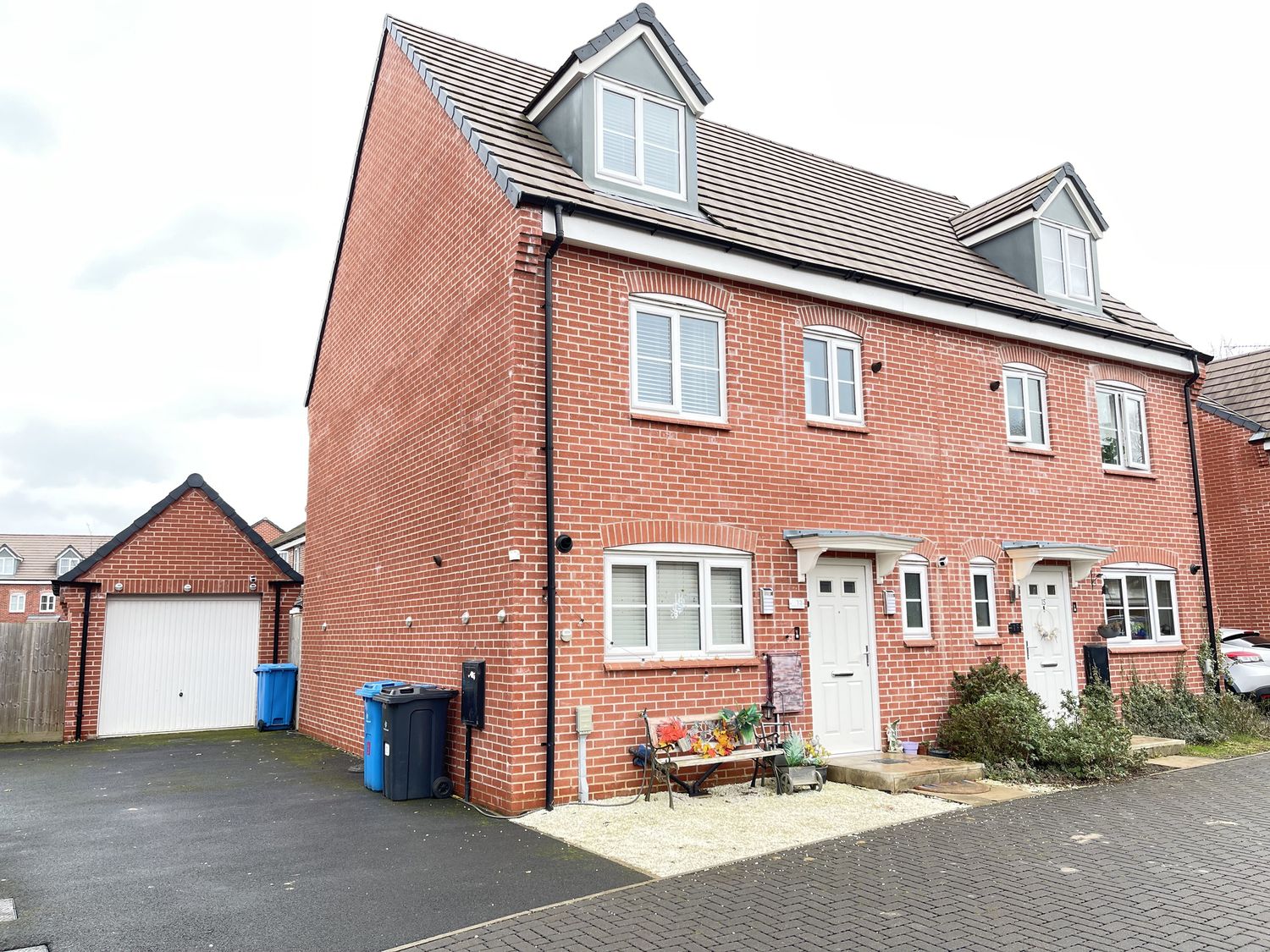 A house with a driveway and garage at Derby Den in Breadsall near Derby