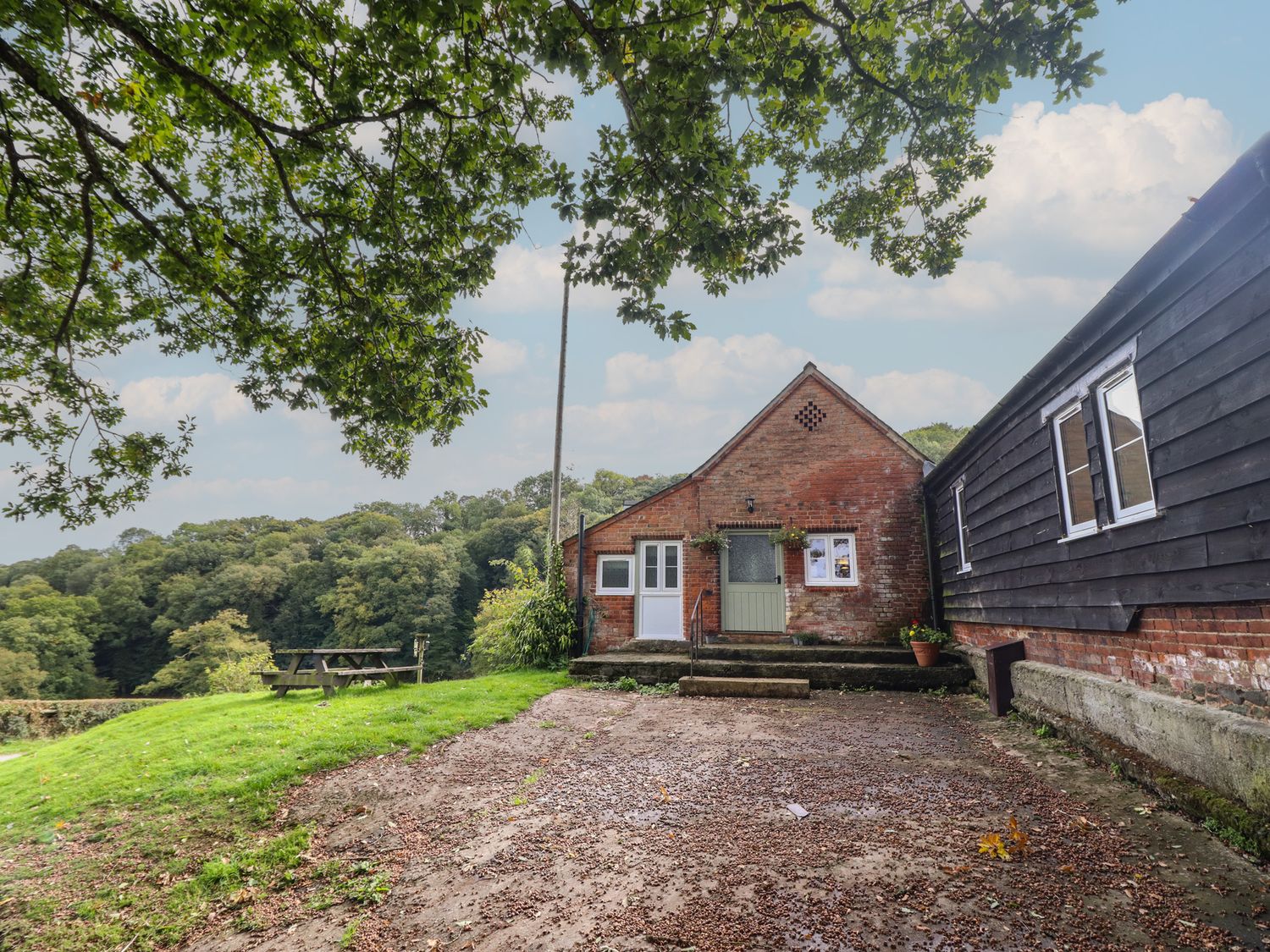 An outdoor area with a building and steps at Upper Pandy Farm in Welshpool