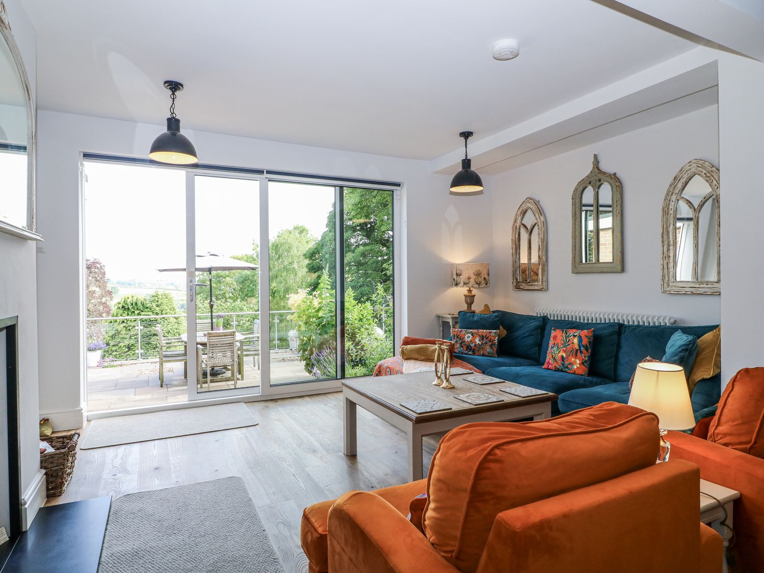 A living room with a sofa and coffee table at The View @ Orchard View Hognaston