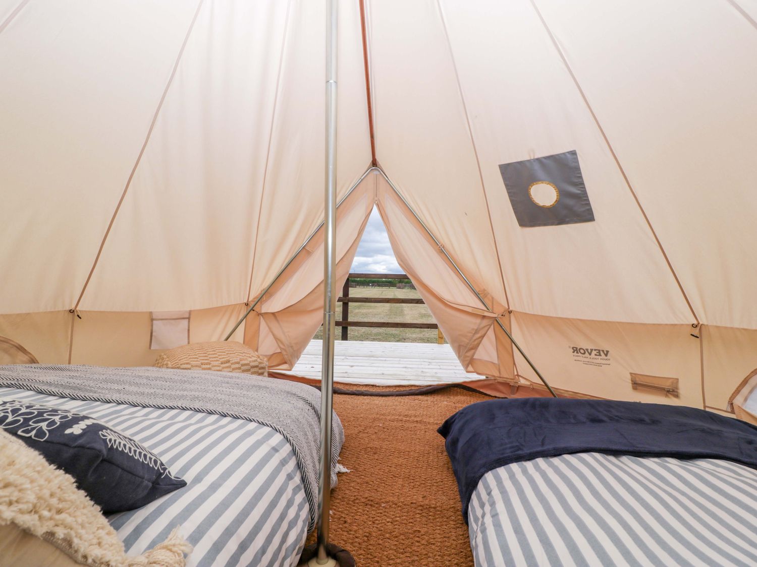 An outdoor tent with beds and pillows at Bell 2 Shades Farm near Malmesbury