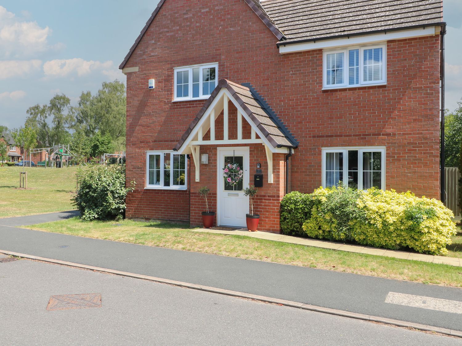 A house with a garden and pathway at 7 Yarnfield Parkway
