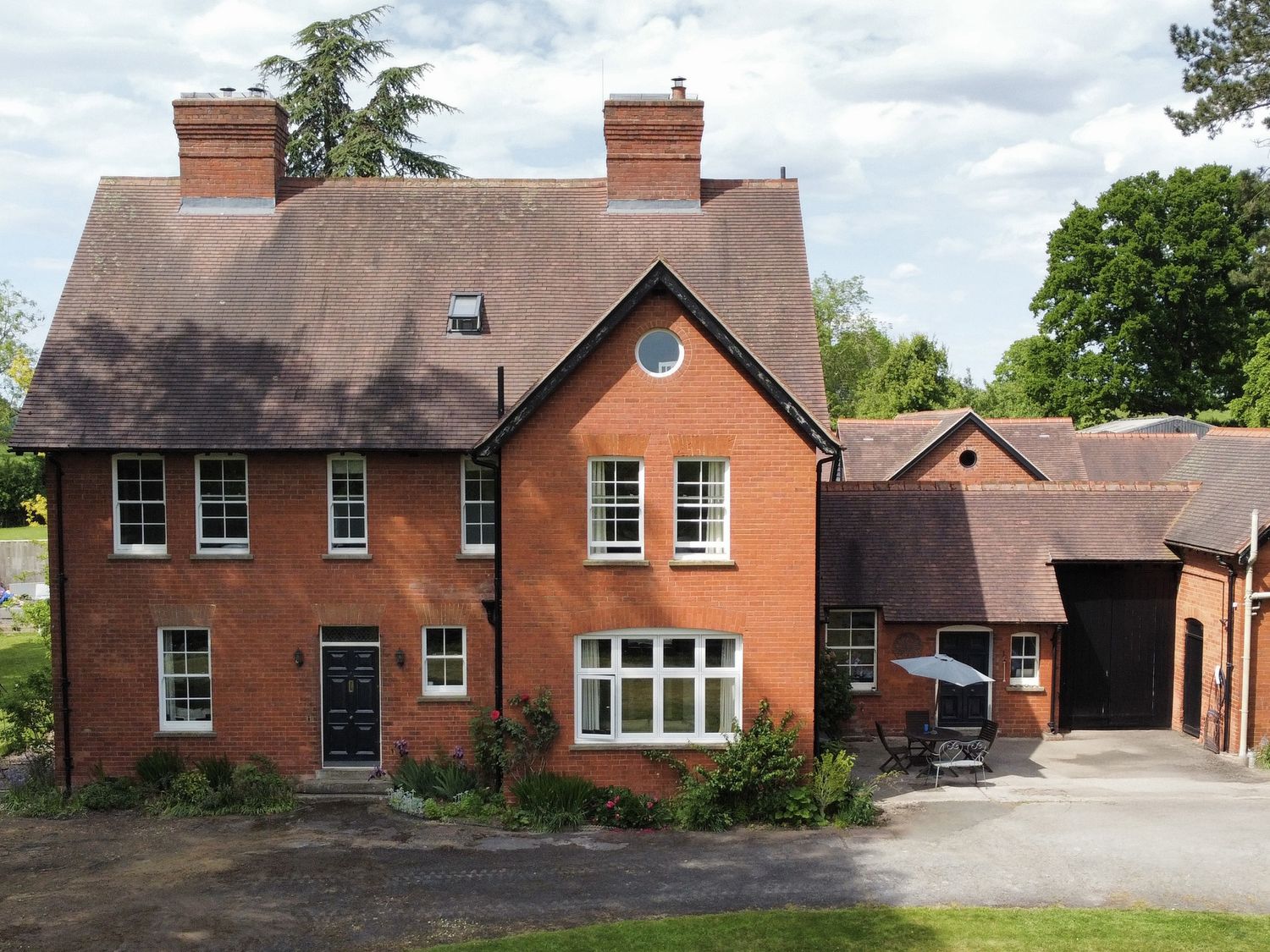 A house with garden and patio at The Old Vicarage in 