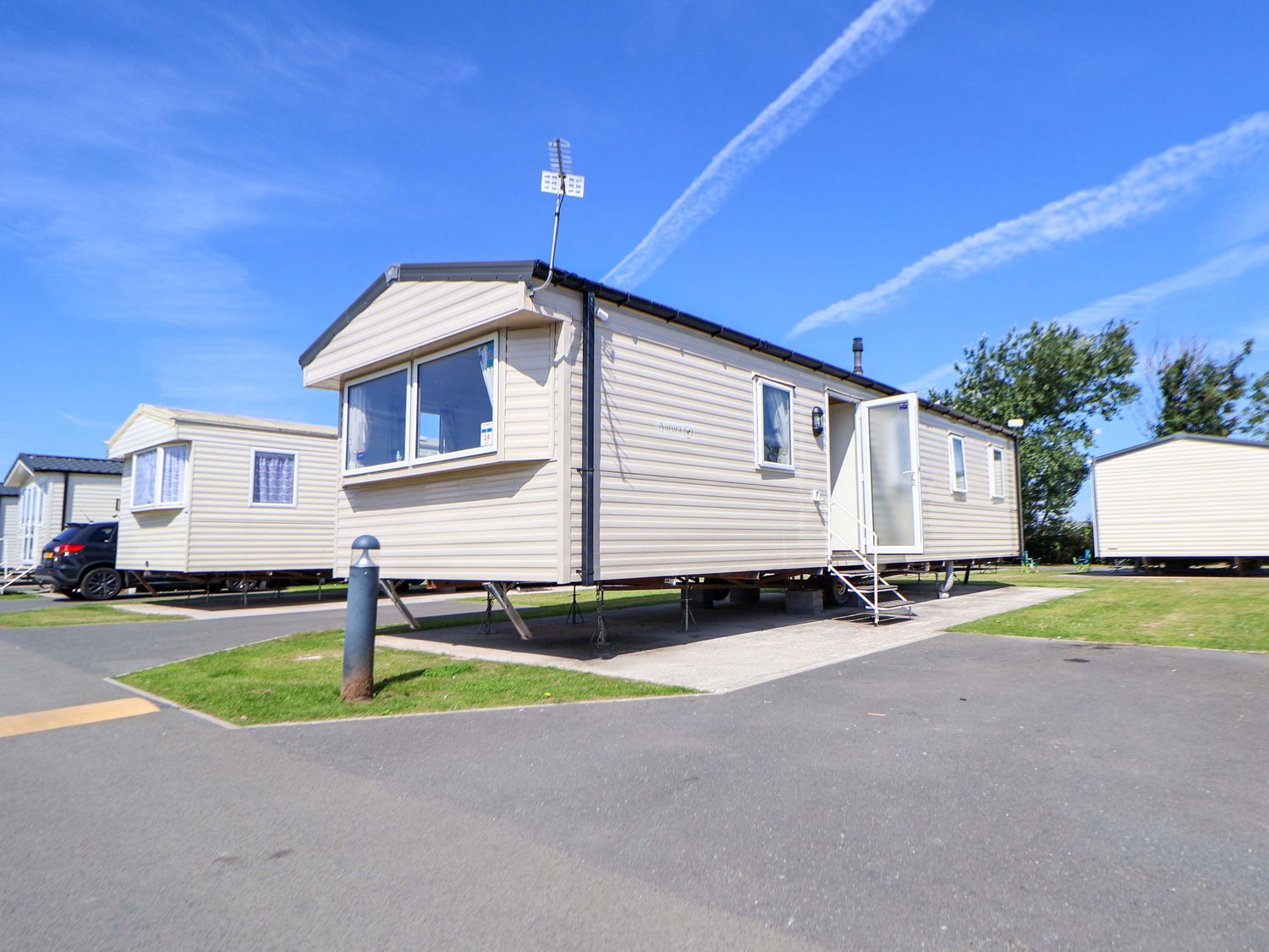 A static caravan with steps and a pathway at Willerby Aurora B14 Towyn