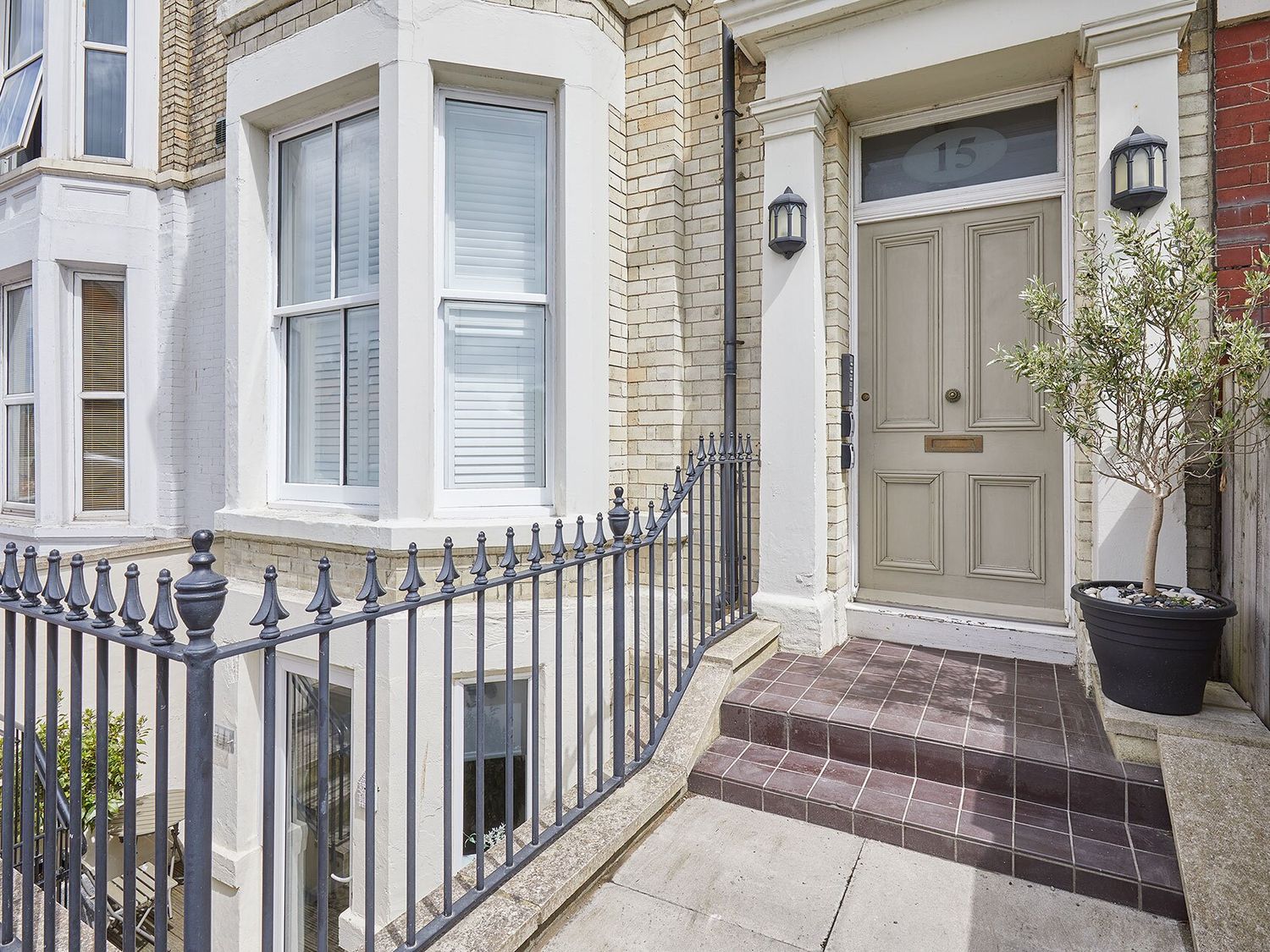 An entrance with a front door and gate at Apartment 2 in Whitby