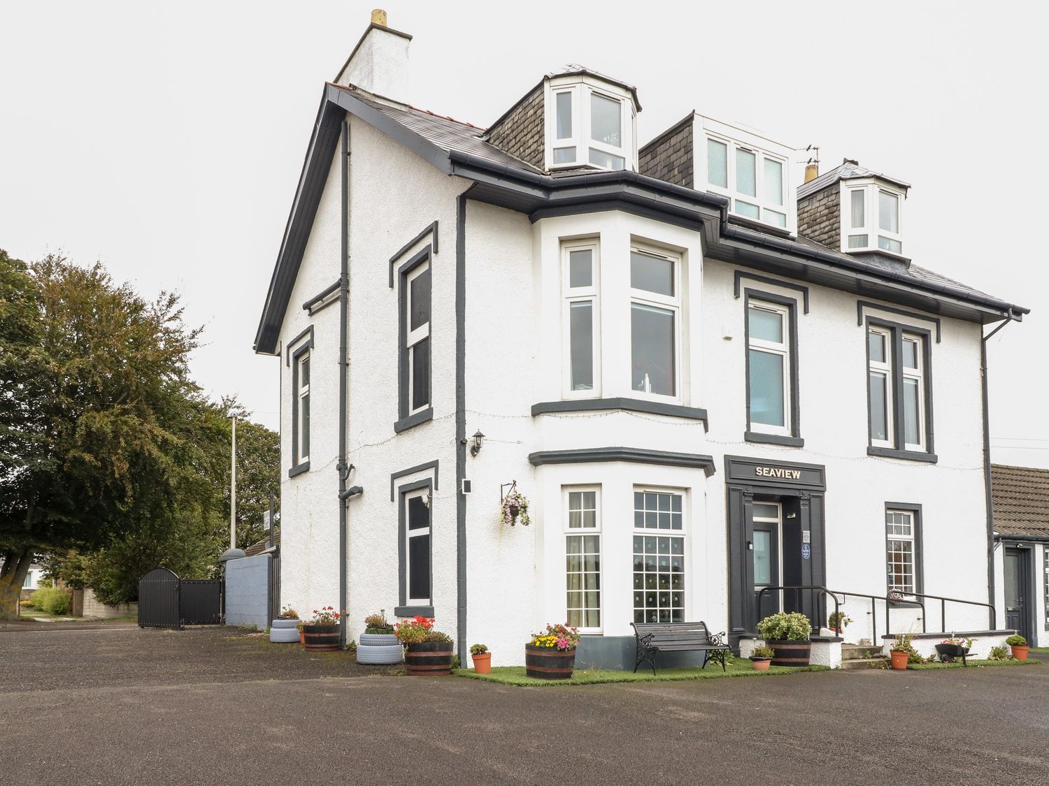 A building with a sign at Seaview Wellness Retreat in Carnoustie