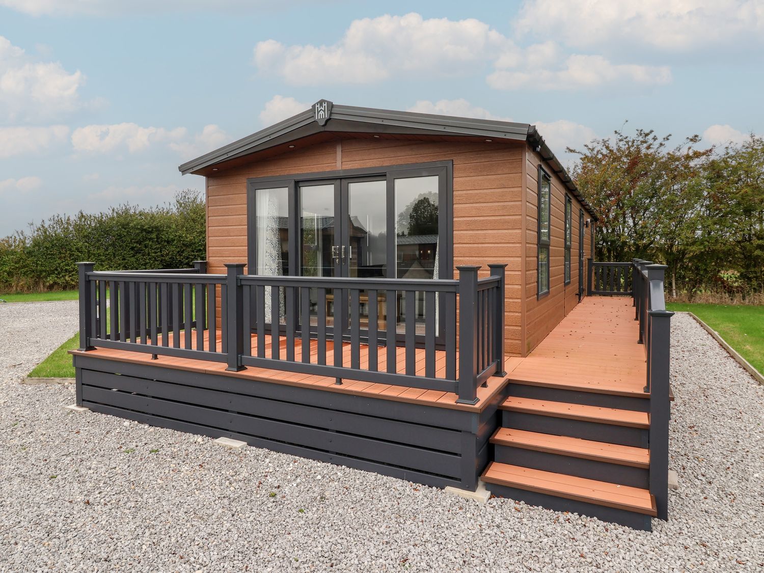 A house with a deck and steps at Meadows Park 3 Great Hatfield near Hornsea