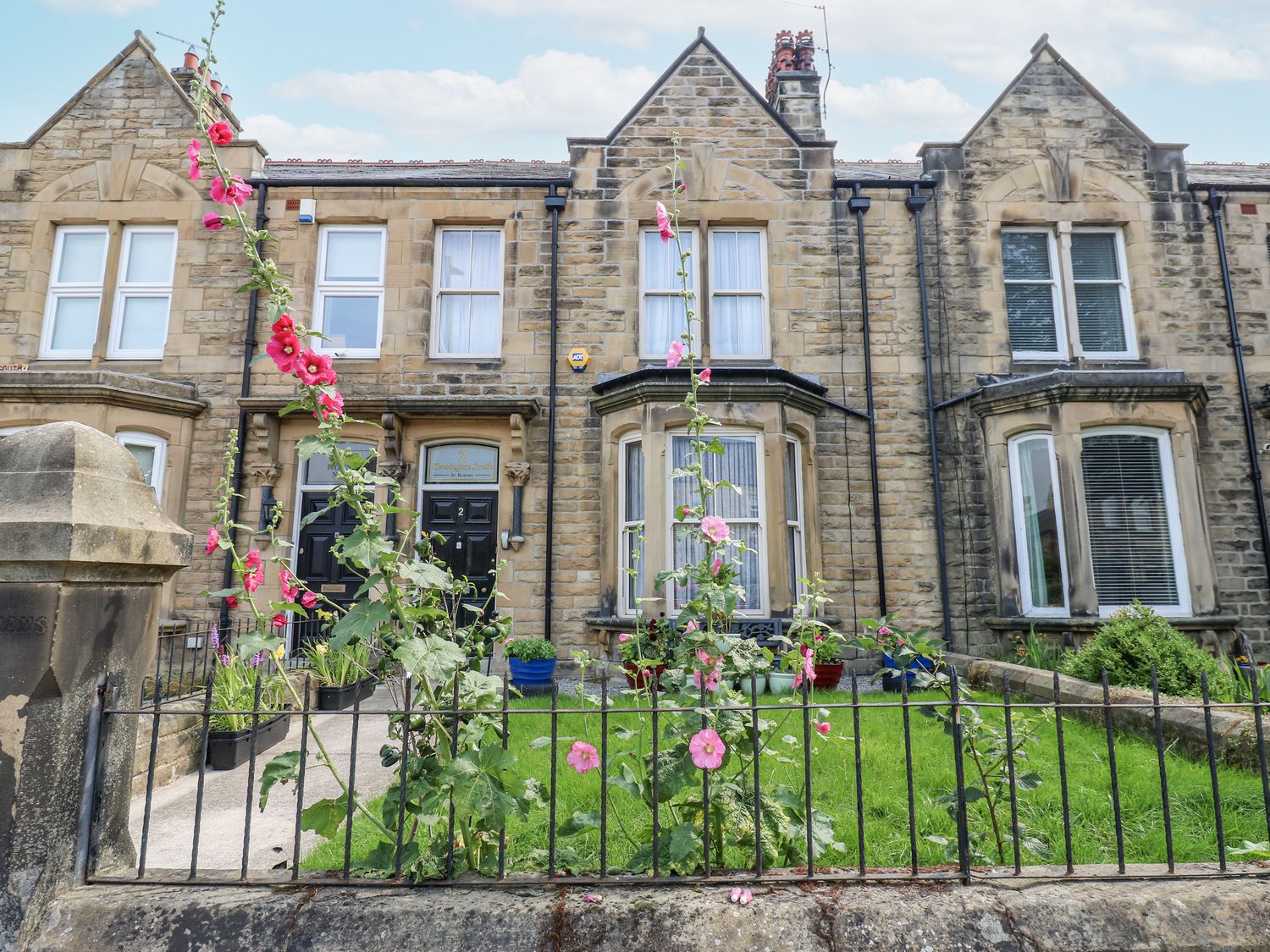 A house with flowers and a garden at St Ronans in Bishop Auckland
