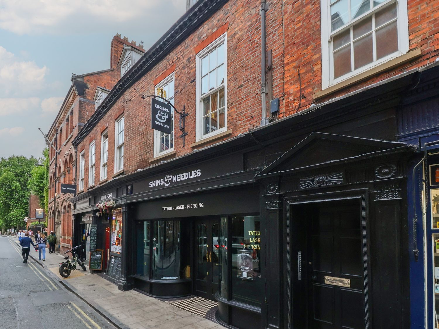 An exterior view of a tattoo shop on a street at Flat 9 York