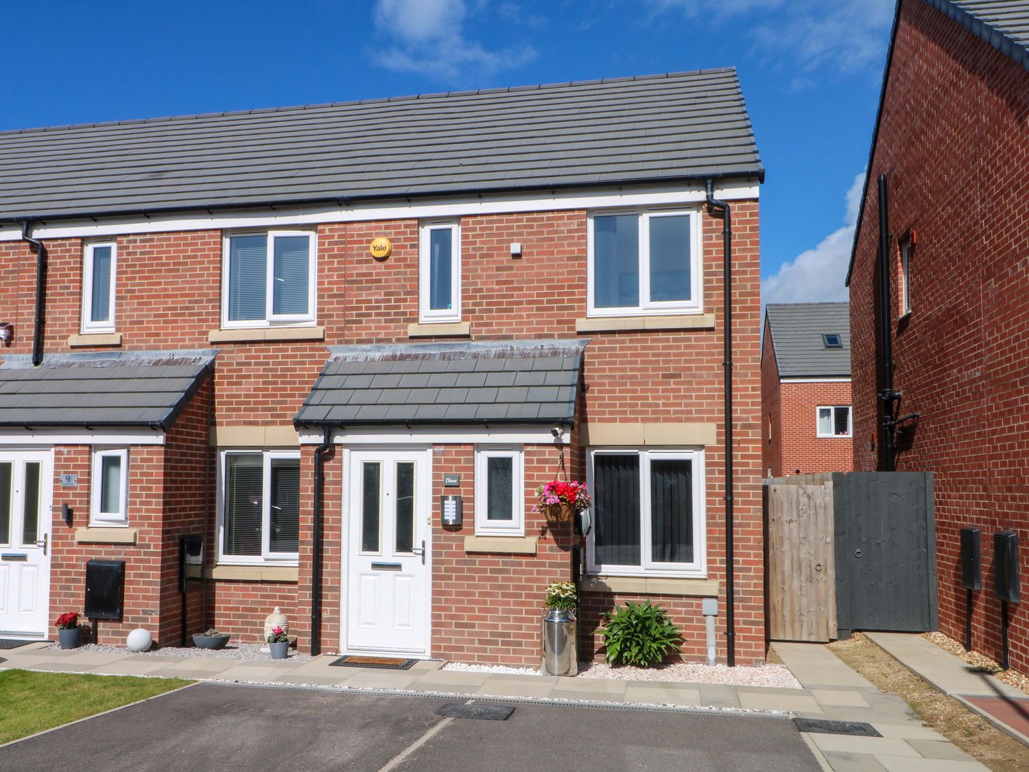A brick house with windows and a door at Beach House Seaside Dunes in Lytham St. Annes