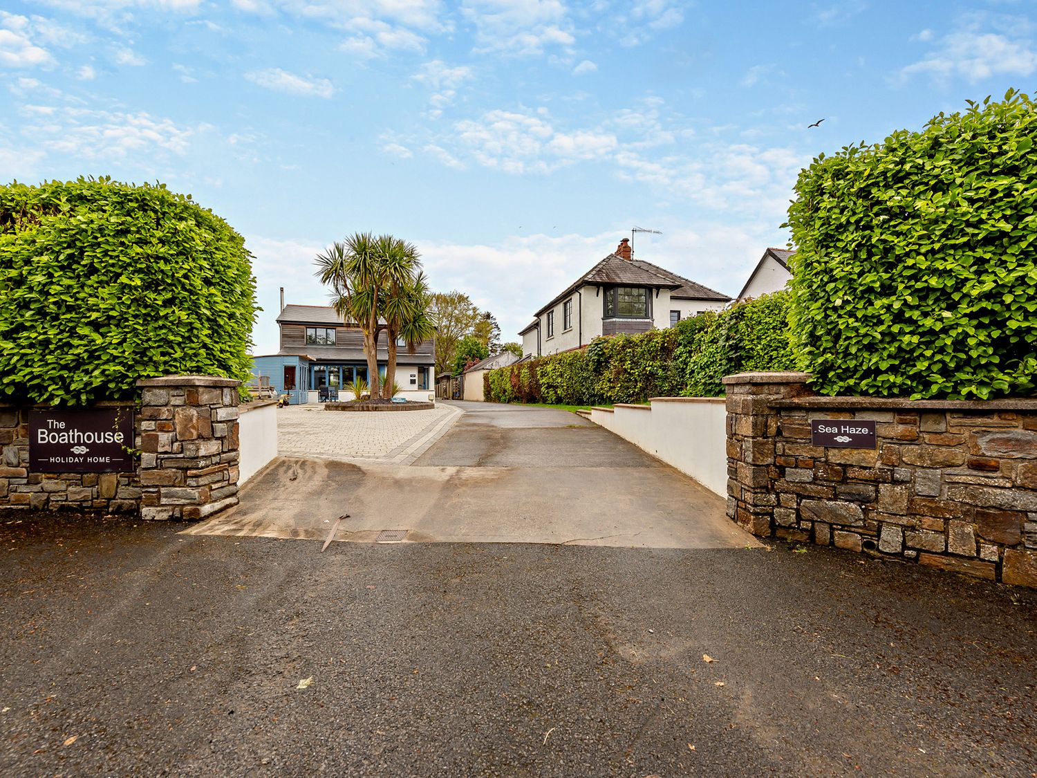 An outdoor view of a driveway leading to Sea Haze in Tenby