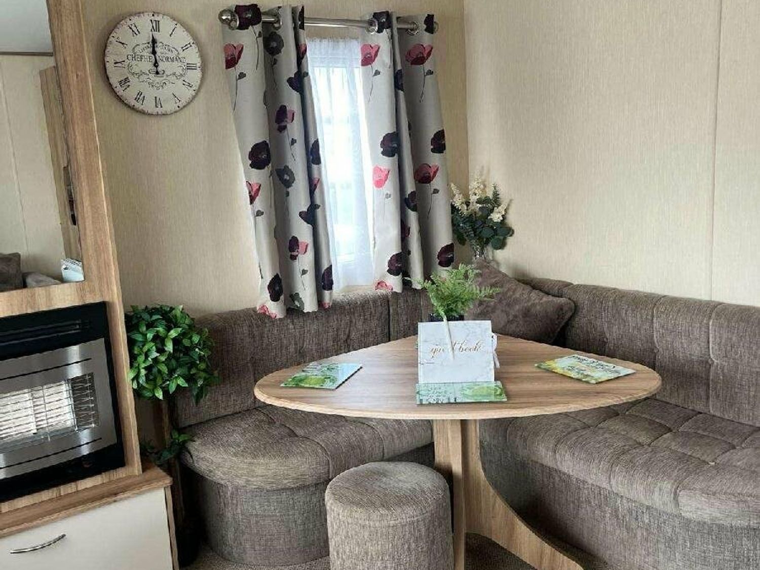 a dining area with a round table and curved seating at Golden Sands Park - Holiday Accommodation 20105 in Ingoldmells, Skegness