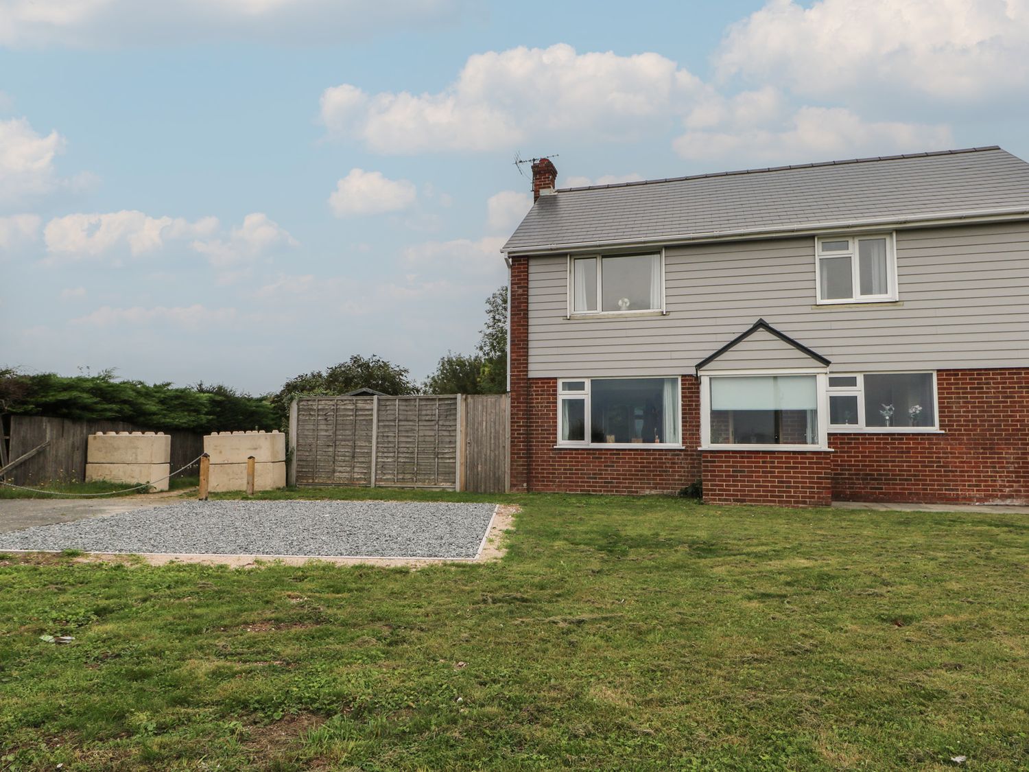 A house with a yard at Walmer Court Farmhouse Deal