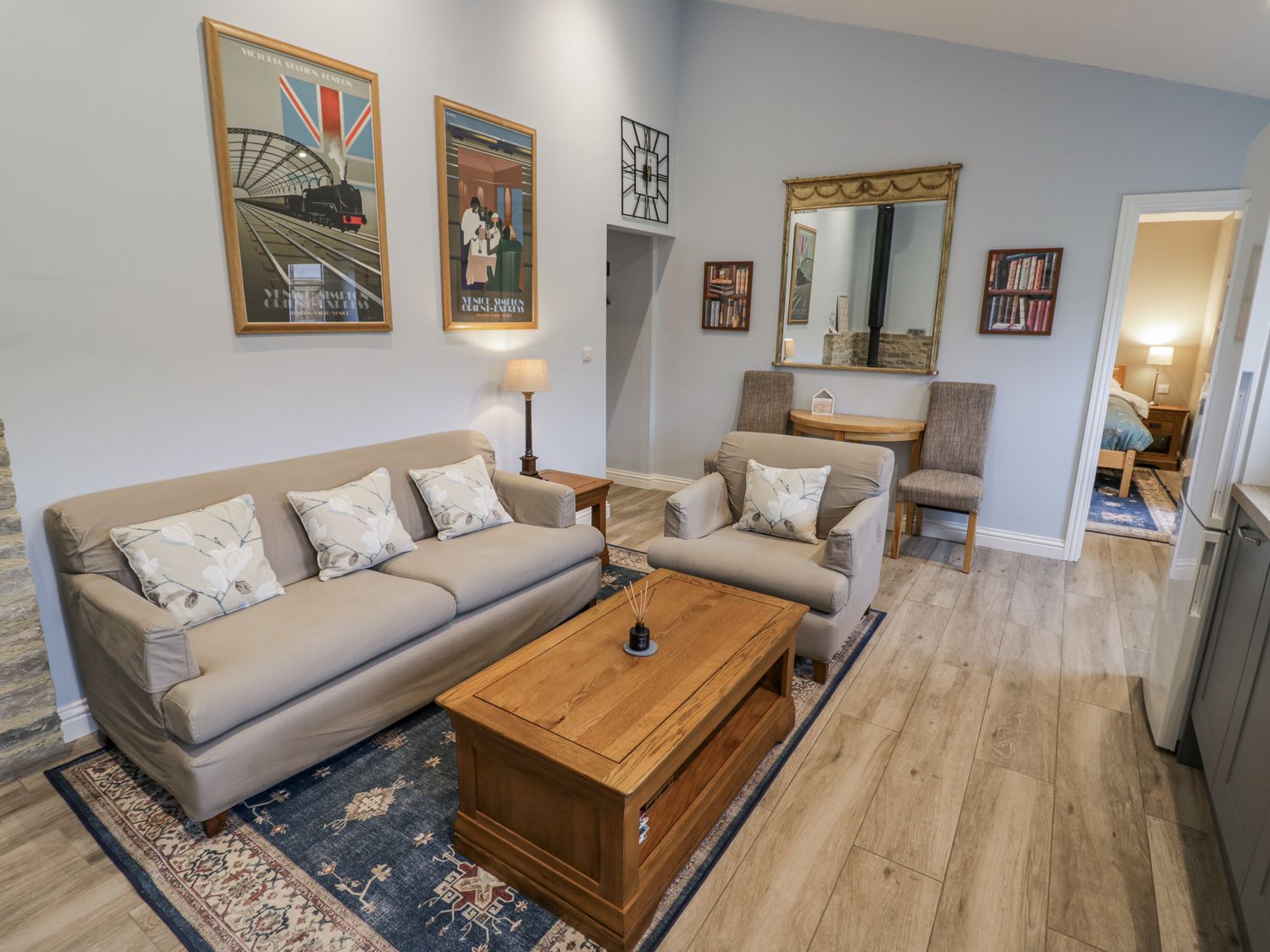 A living room with a sofa and armchair at Rose Stables Black Bourton near Bampton