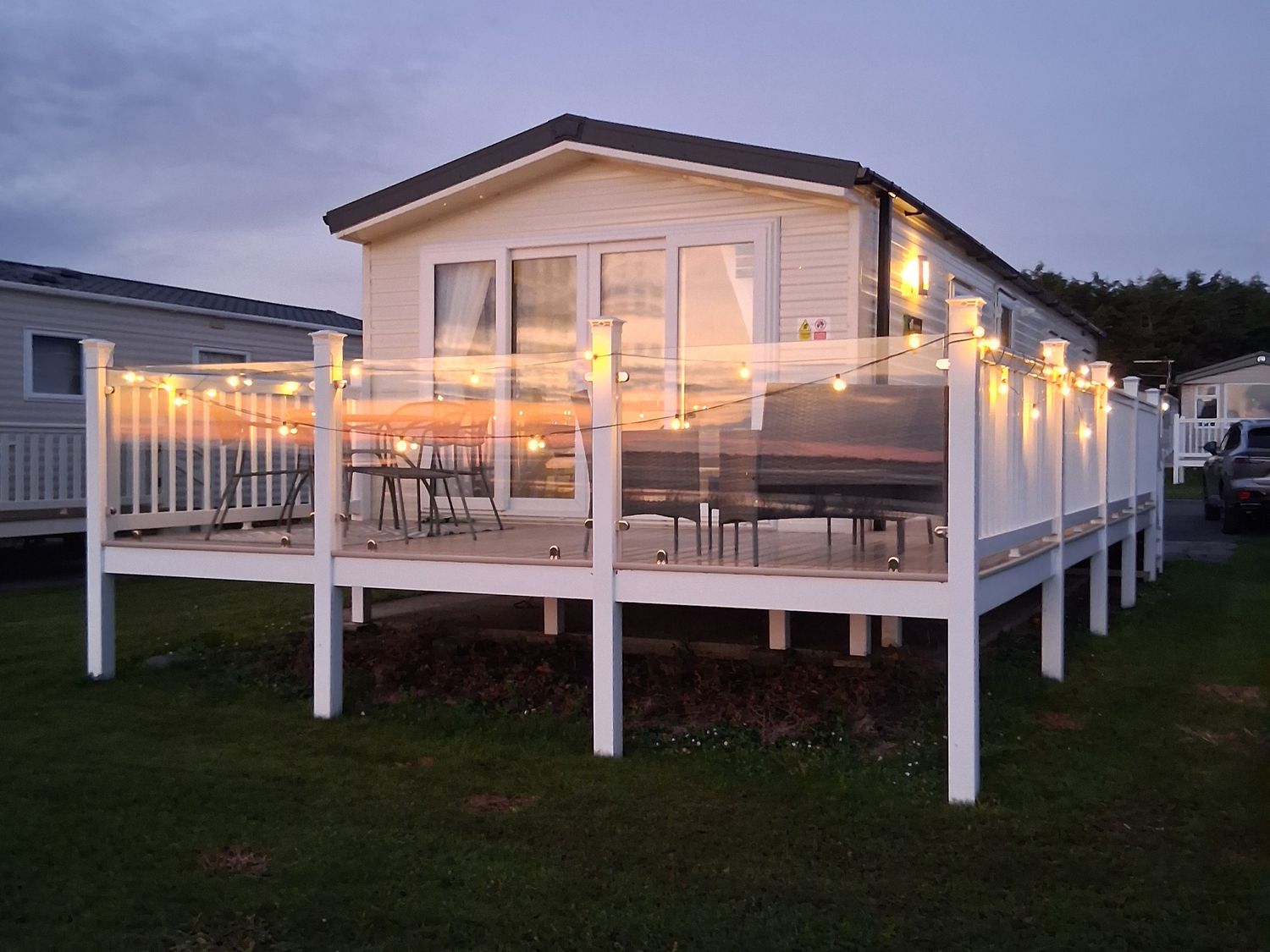 An outdoor area with a holiday home and seating at Willerby Malton 2023 in Kidwelly