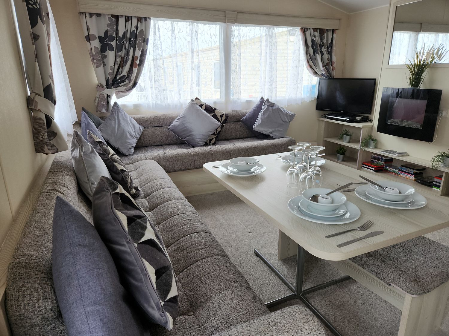A living room with a sofa and table set at 123 Elms in 
