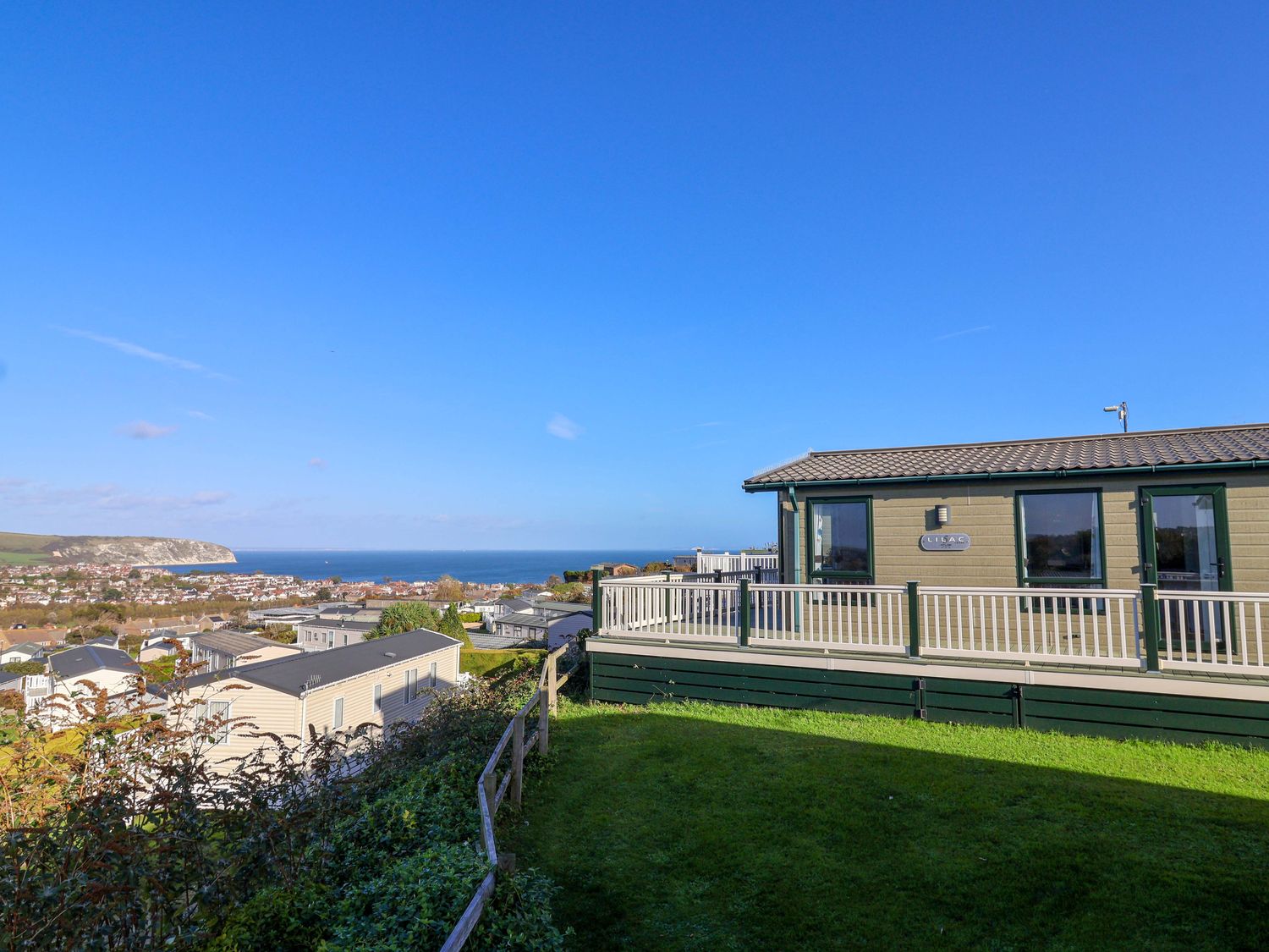 A view of the sea and surroundings from a mobile home at 91 Swanage Coastal Park in Swanage