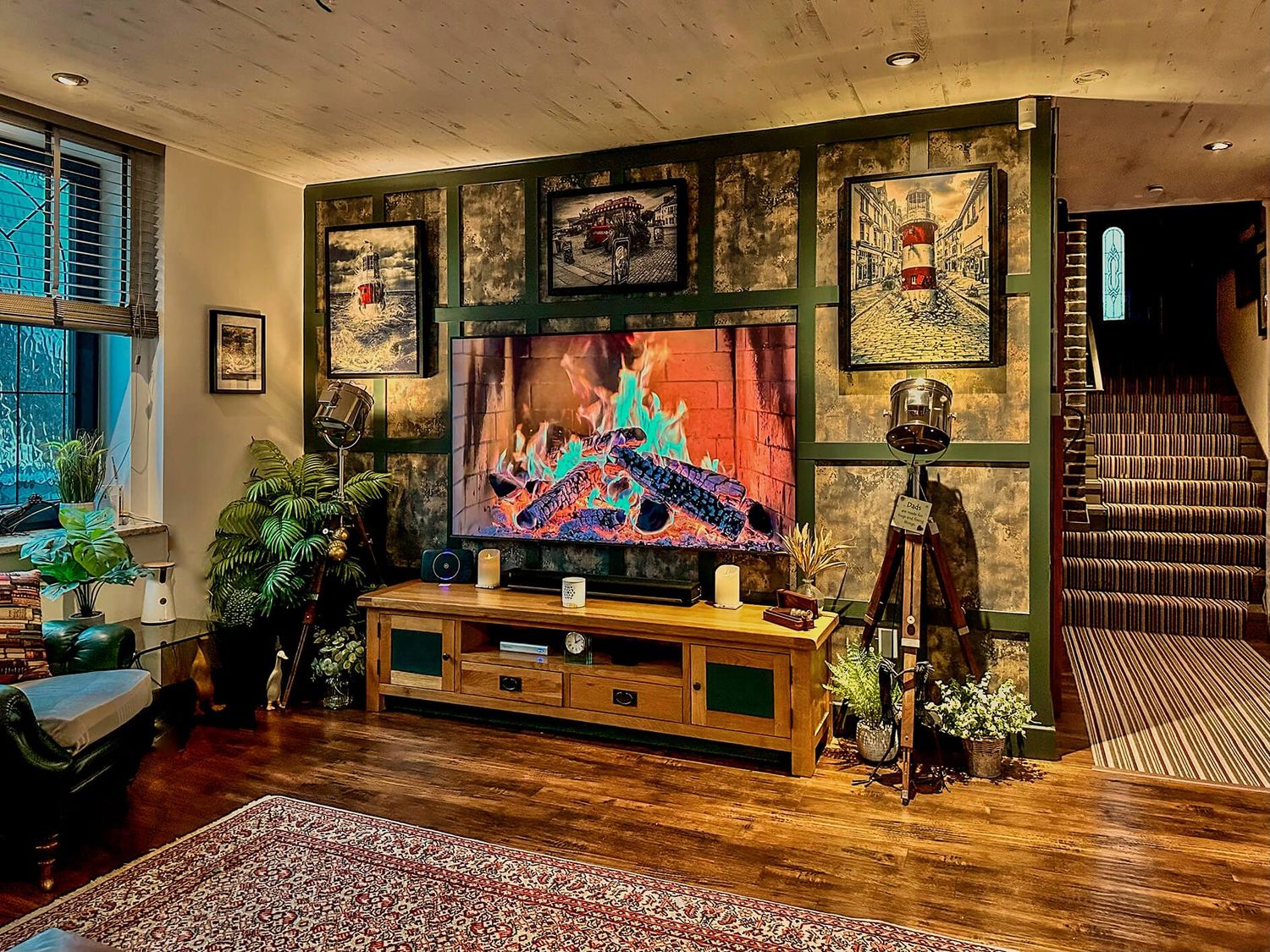 A living room with a fireplace and television at a property