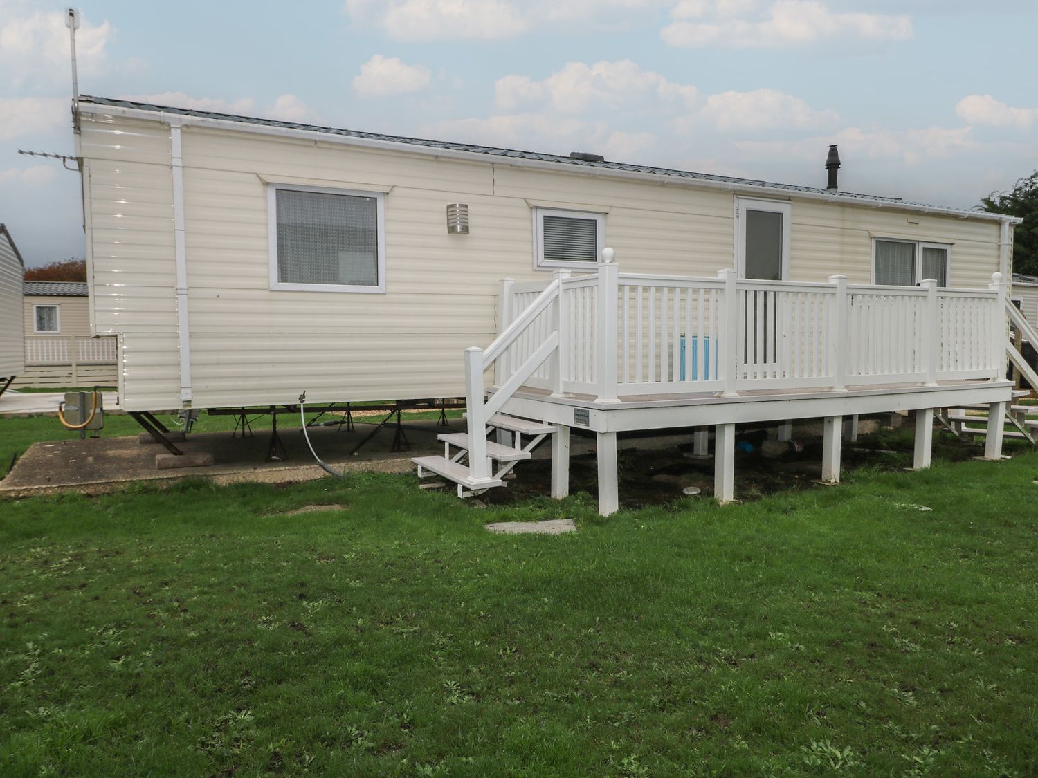 A mobile home with a deck and steps in Southampton