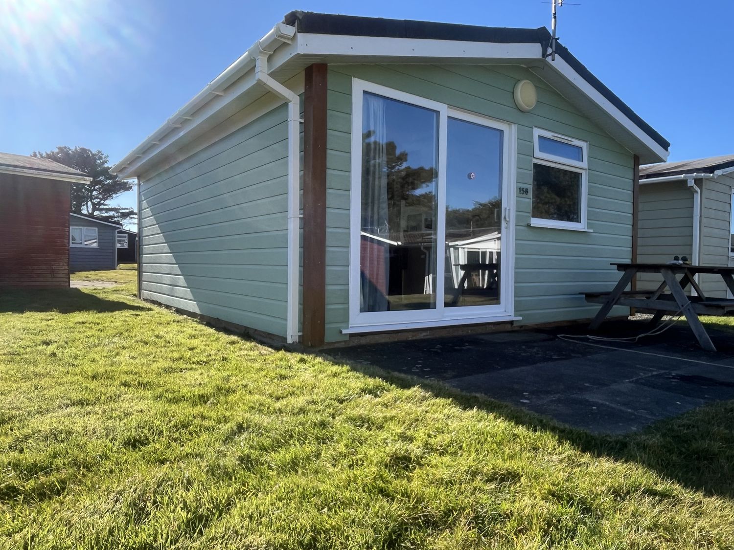 An outdoor view of a bungalow with a table at Embury in 