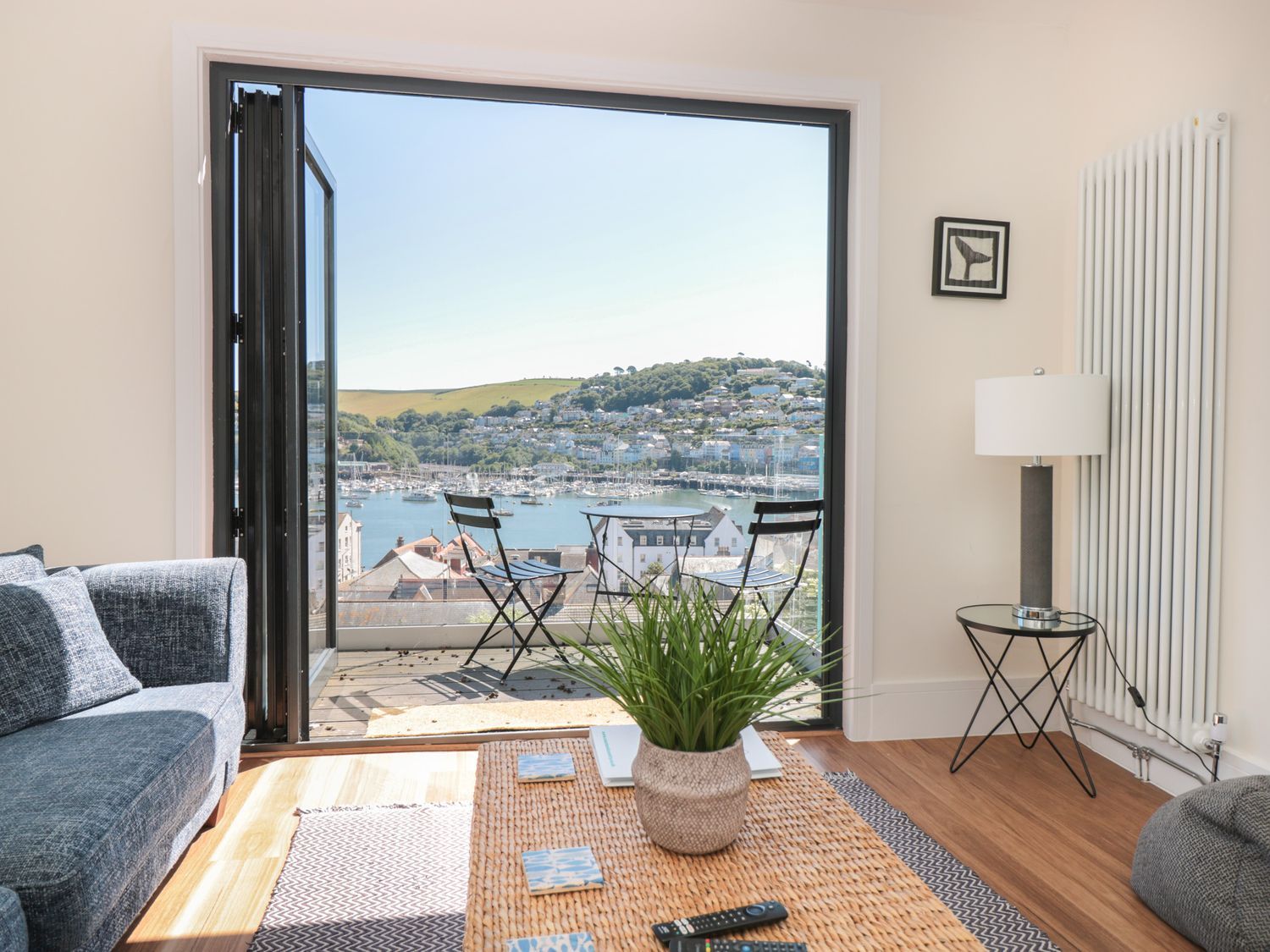 A living room with a view of the harbor at Ty'r Ddraig in Dartmouth