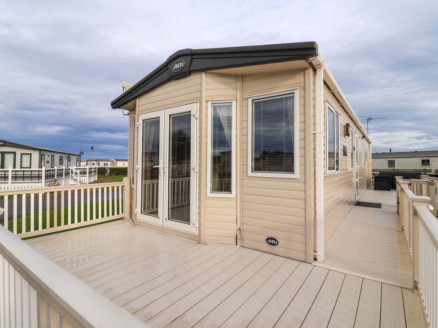A cabin with a deck and windows at The Drift in High Skirlington near Skipsea