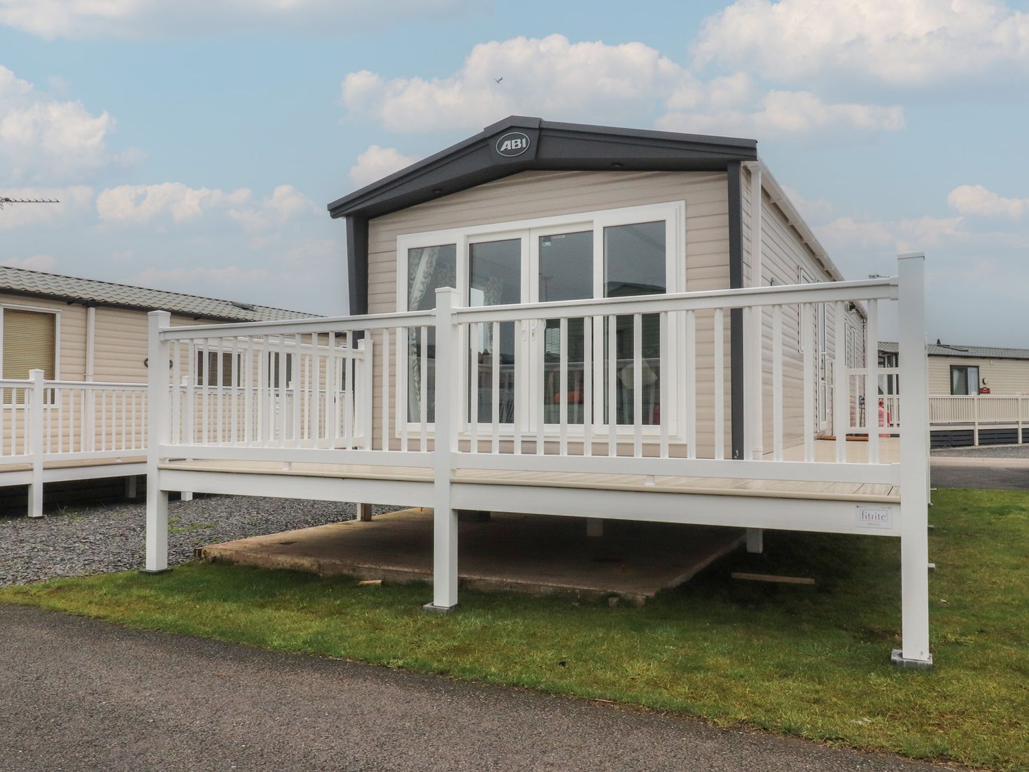 A mobile home with a deck at The Retreat in Morecambe