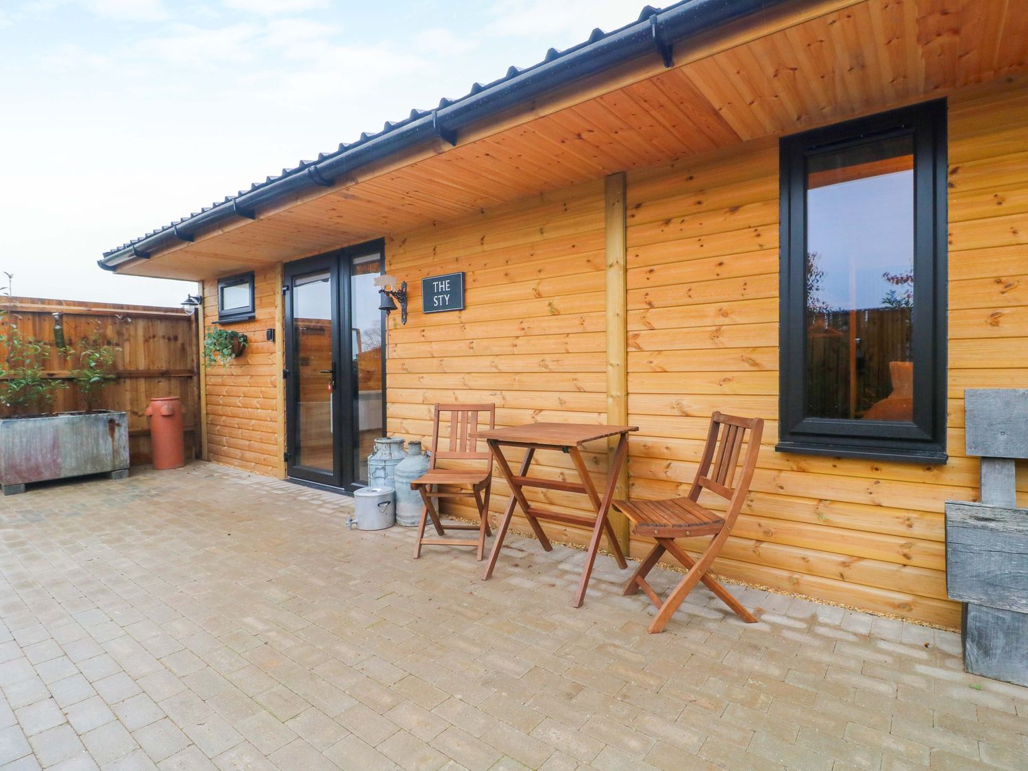 An outdoor area with a table and chairs at The Sty in Derby