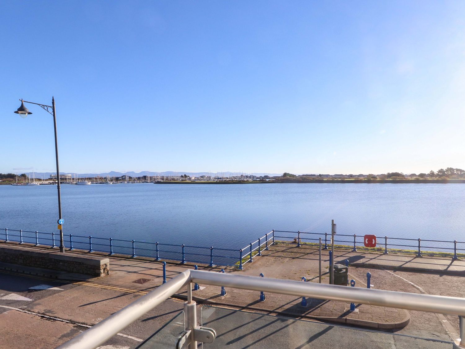View of water and boats from a pier at 1 Marina View in Pwllheli