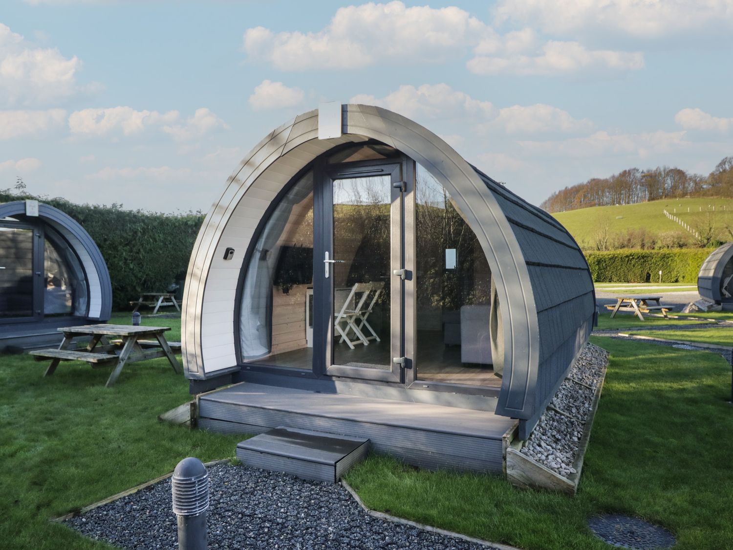 A pod with steps and seating area at Pod 8 (No Pets) Tewitfield