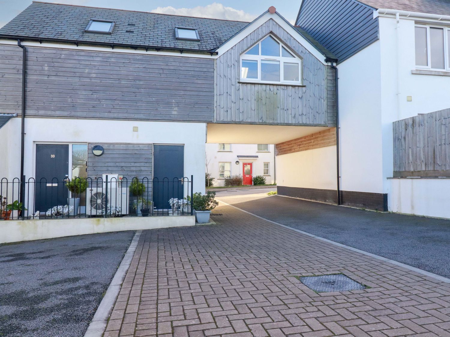 A building entrance with a pathway at 33 Fordh Tobmen St. Agnes
