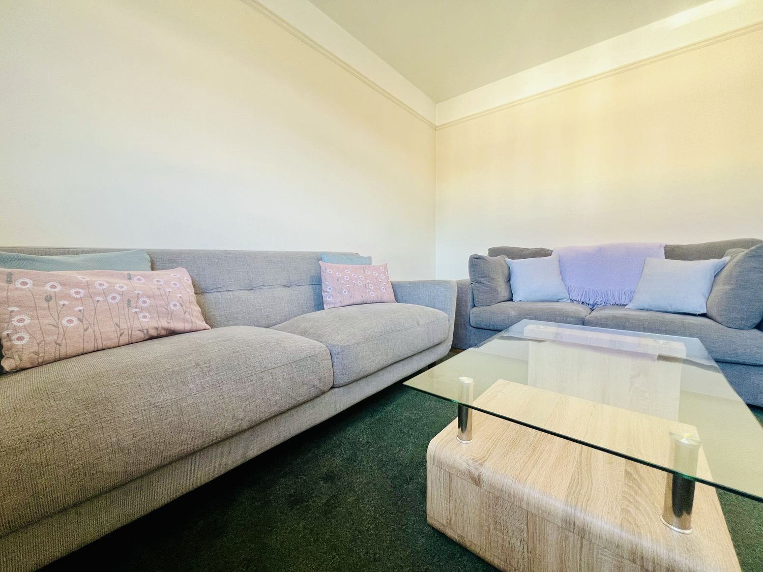 A living room with sofas and a coffee table at 11 Langer Road in Felixstowe