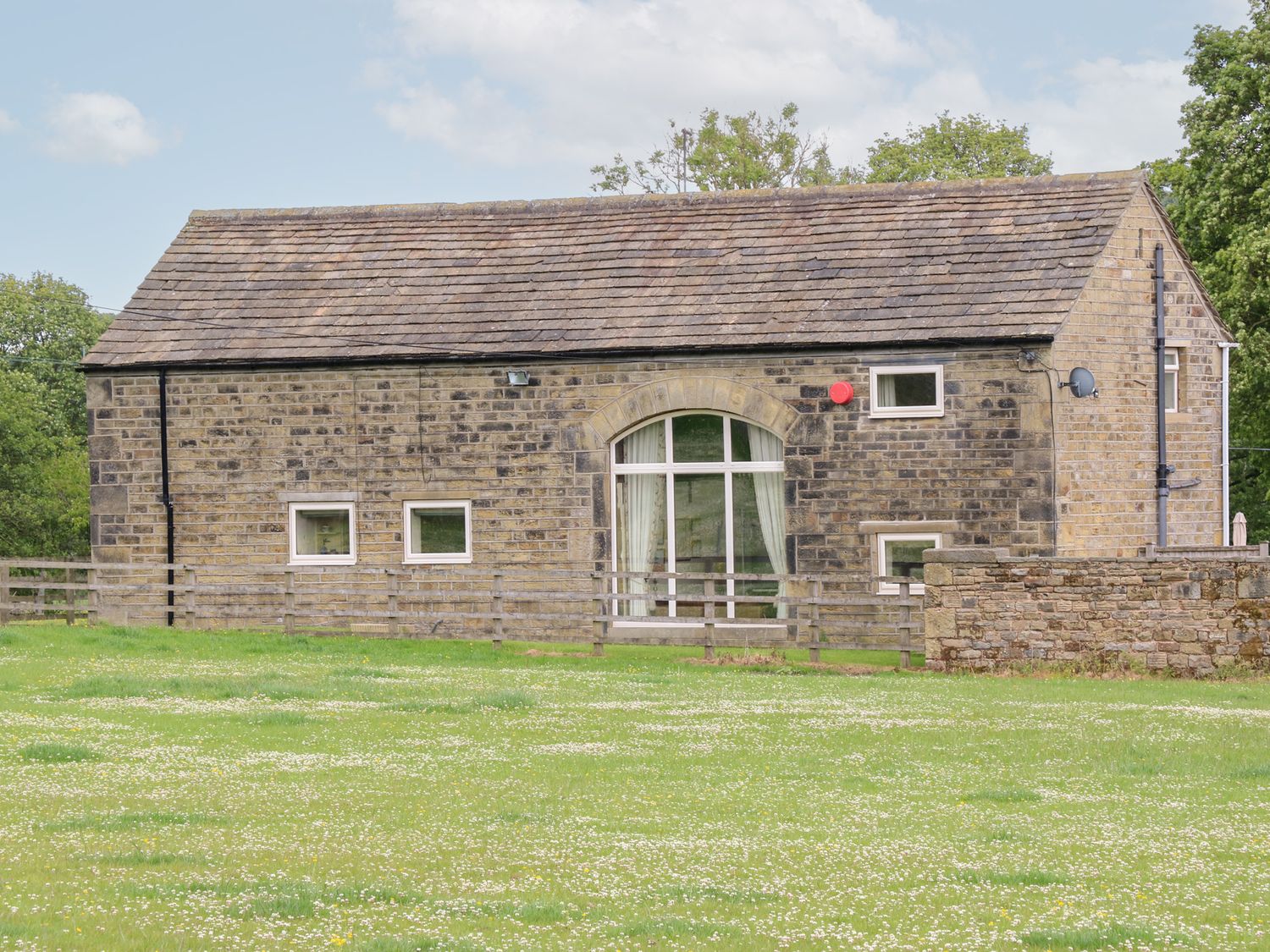 A building with windows and a door at Bullace Barn Millhouse Green