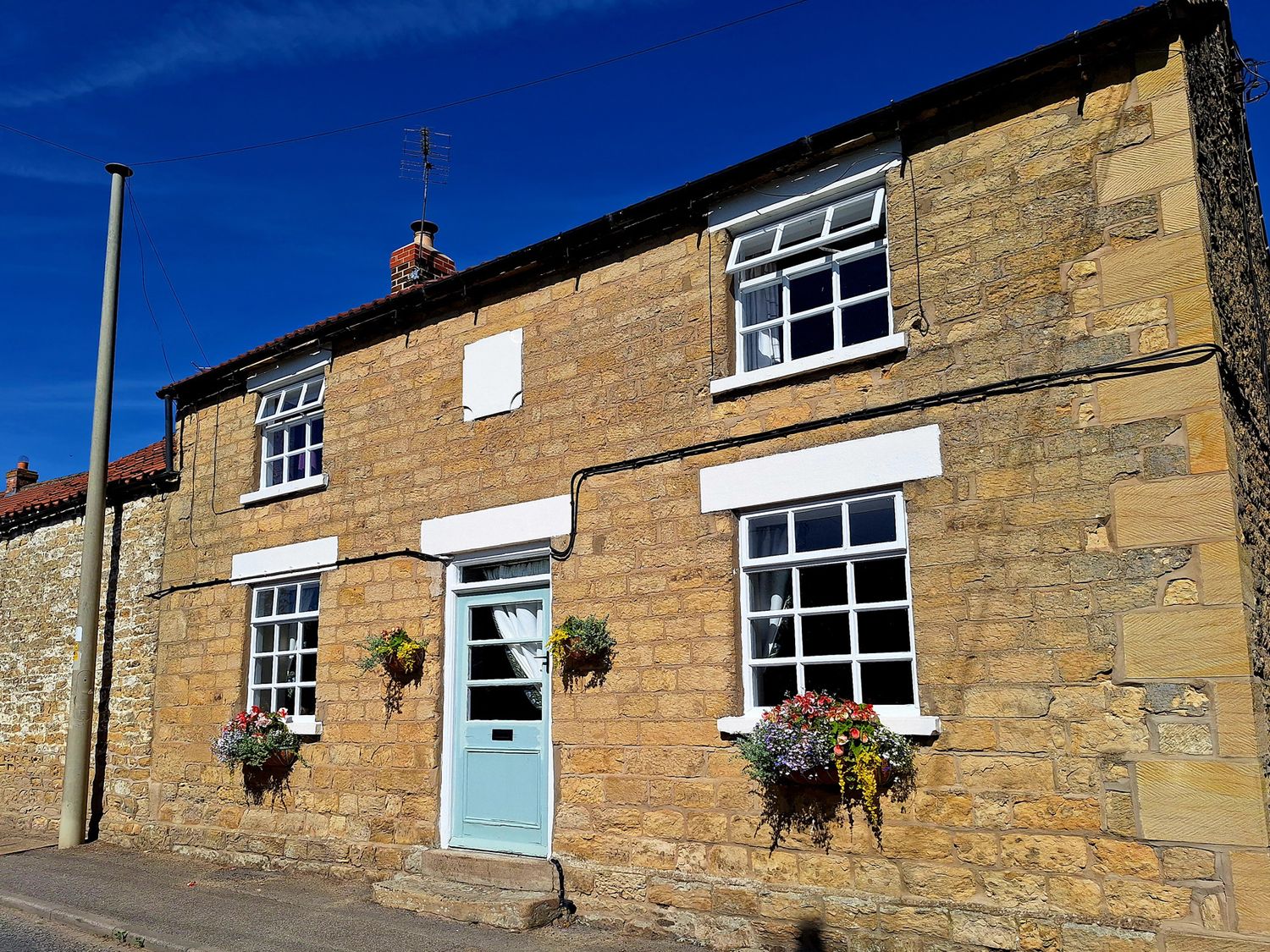 A house with windows and flower pots at Boundcliffe Farm Allerston near Pickering