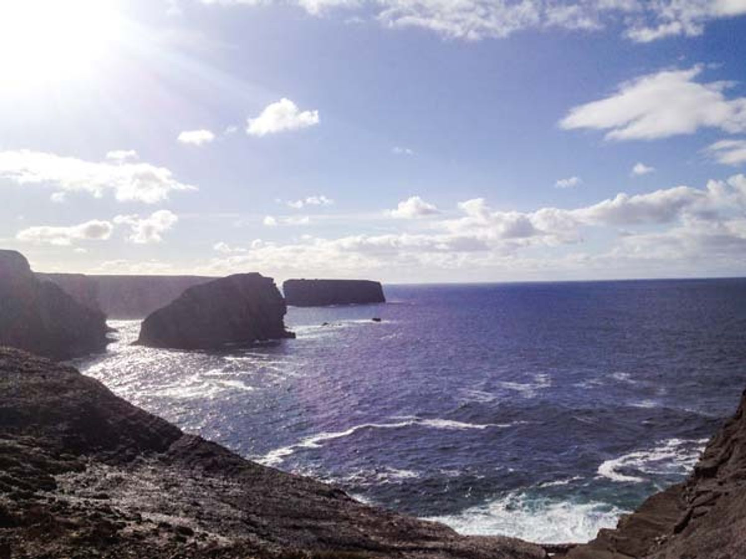 A coastal cliff view with rocky shorelines and ocean at Kilkee Cottage in Kilkee County Clare